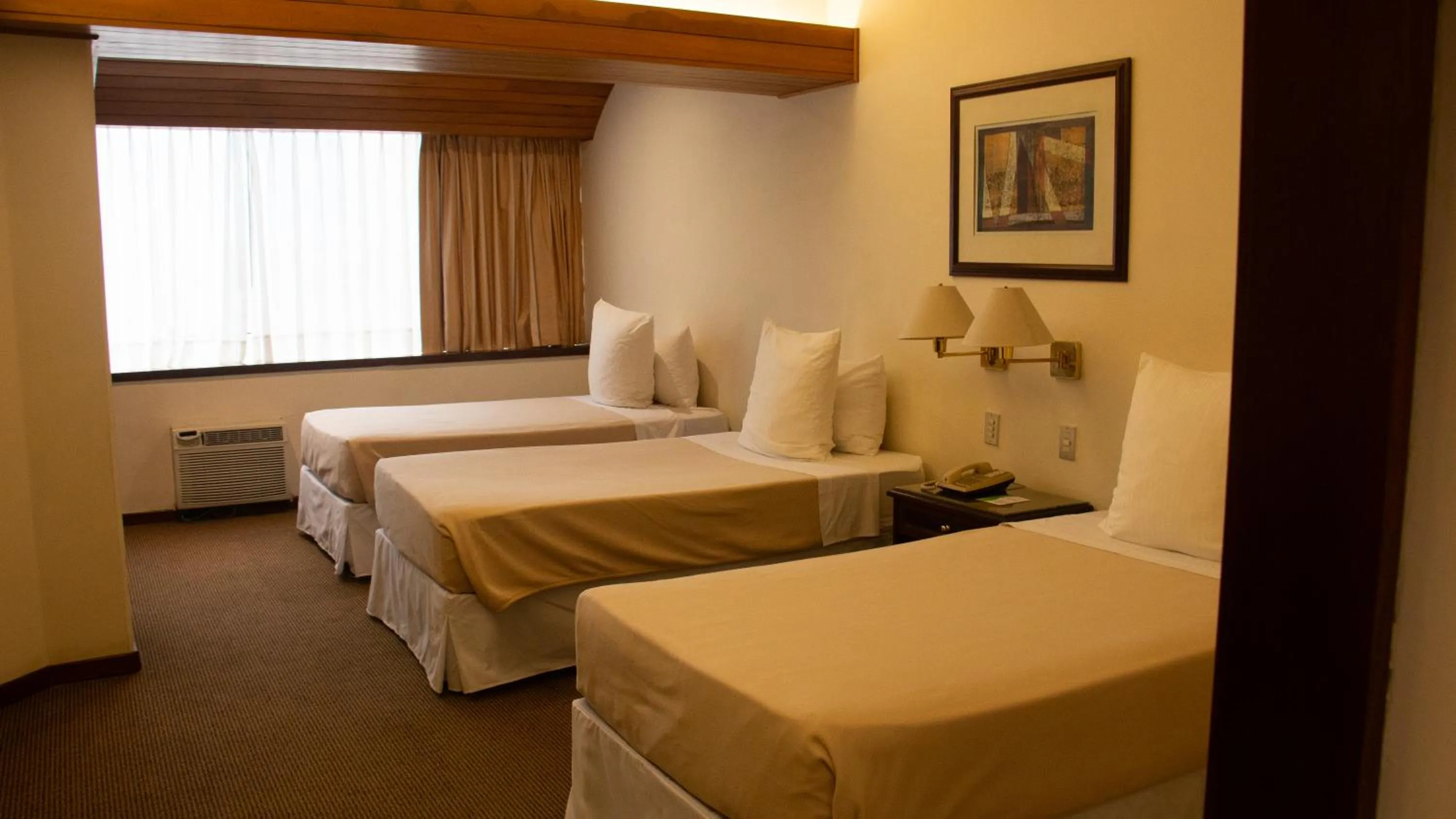 Bed in J&A Classic Hotel