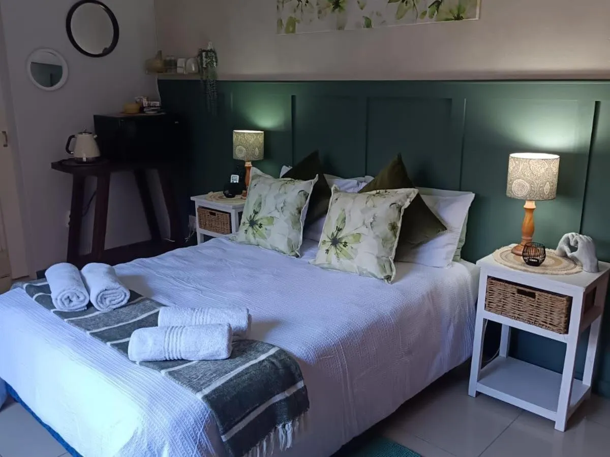 Bed in Bluewater Guesthouse