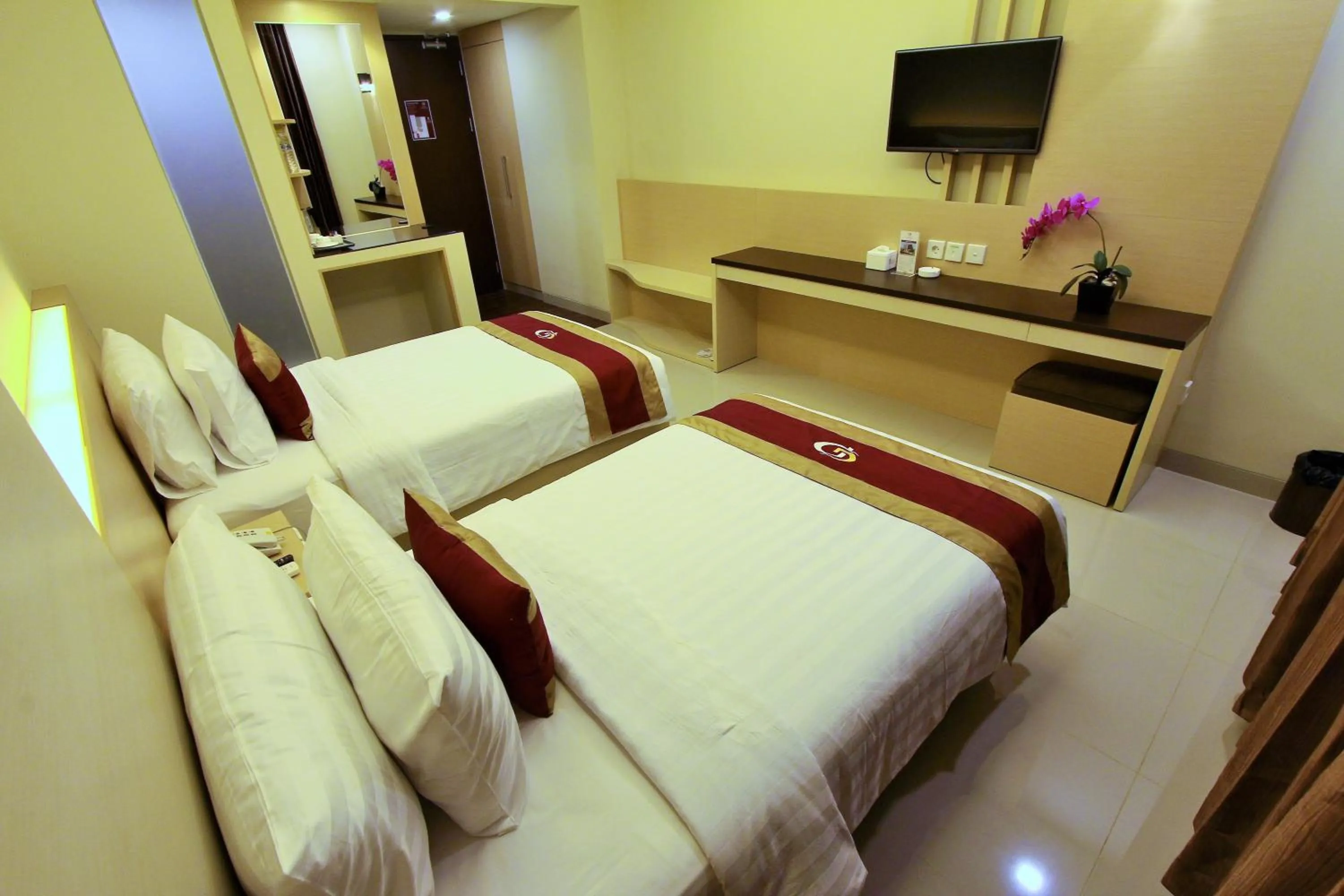 Bed in Grand Parama Hotel