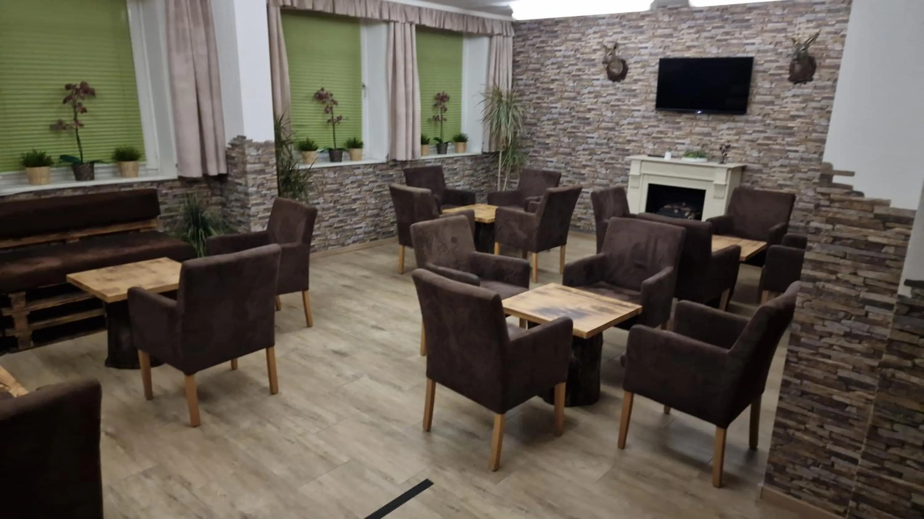 Communal lounge/ TV room in Hotel A2