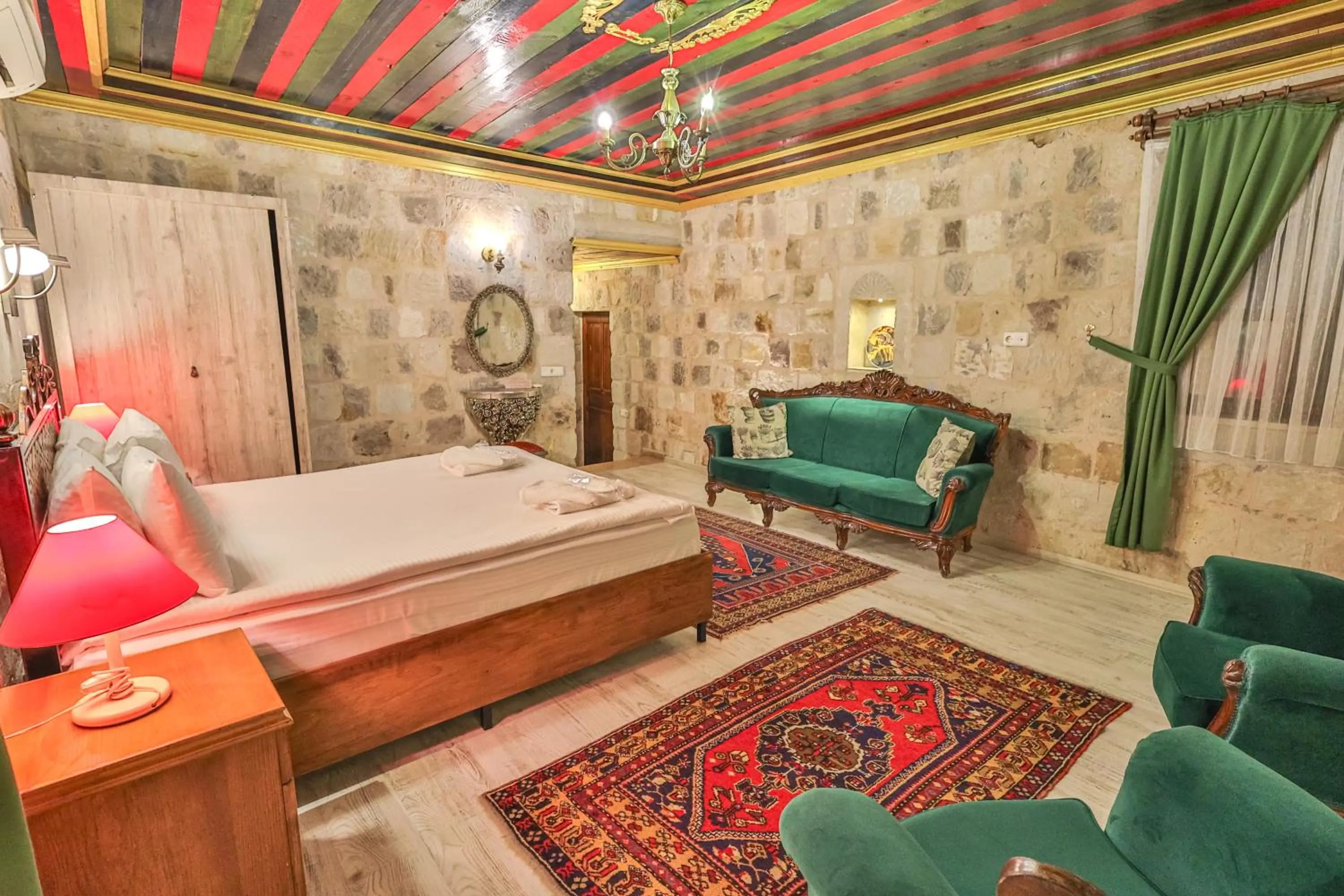 Bed in Bedrock Cave Hotel