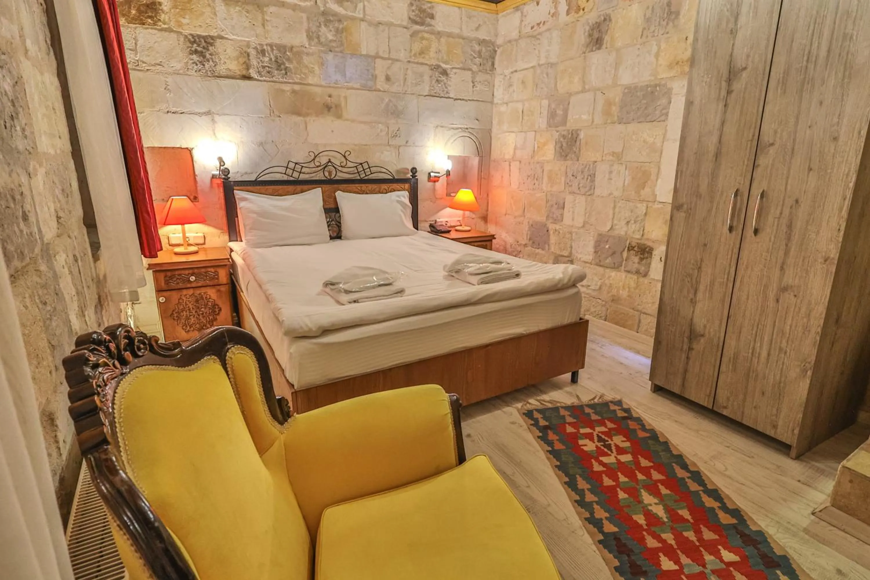 Bed in Bedrock Cave Hotel