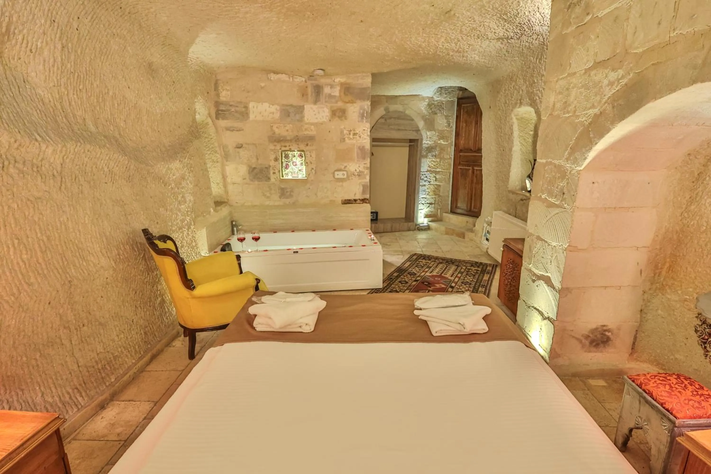 Bed in Bedrock Cave Hotel