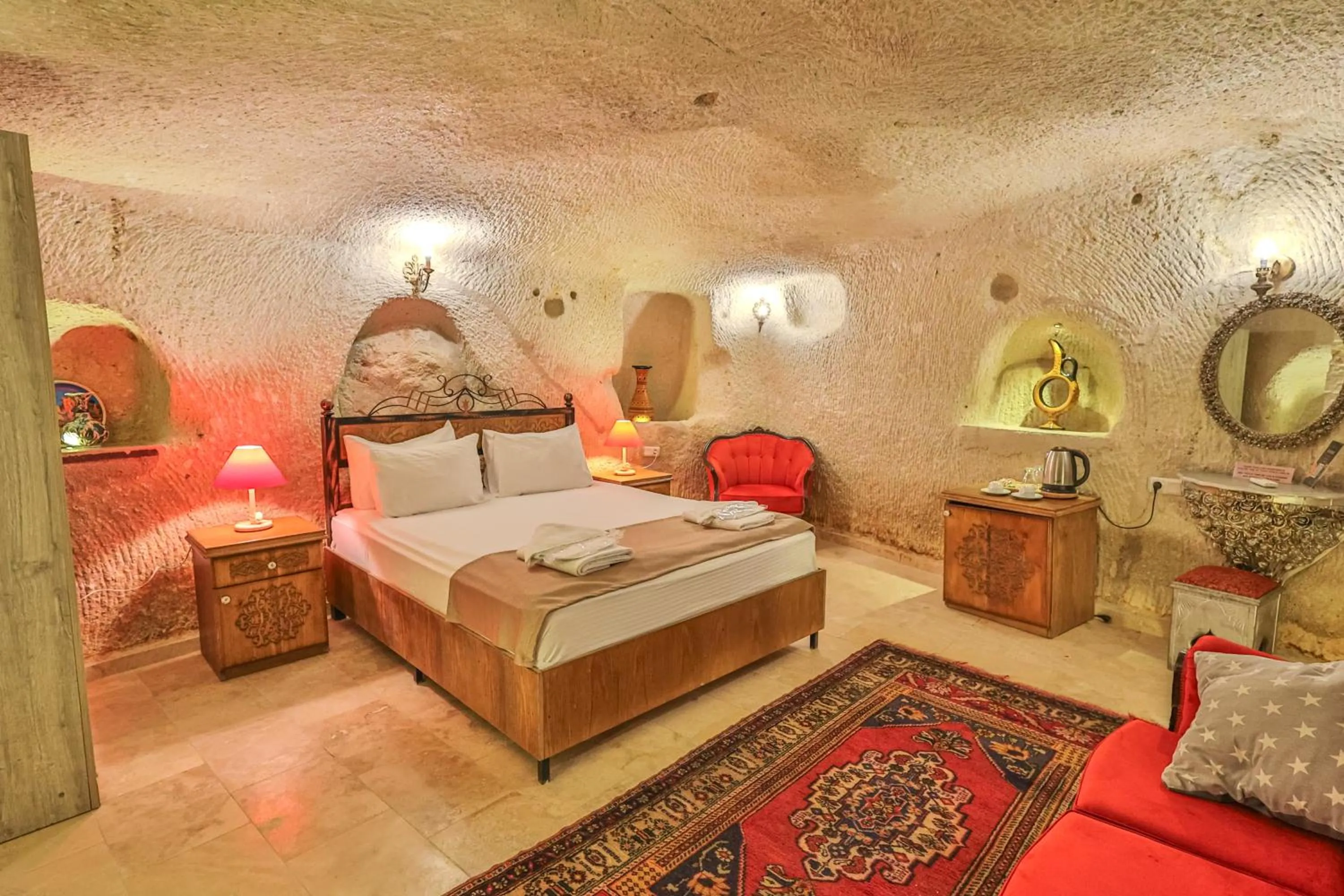 Bed in Bedrock Cave Hotel