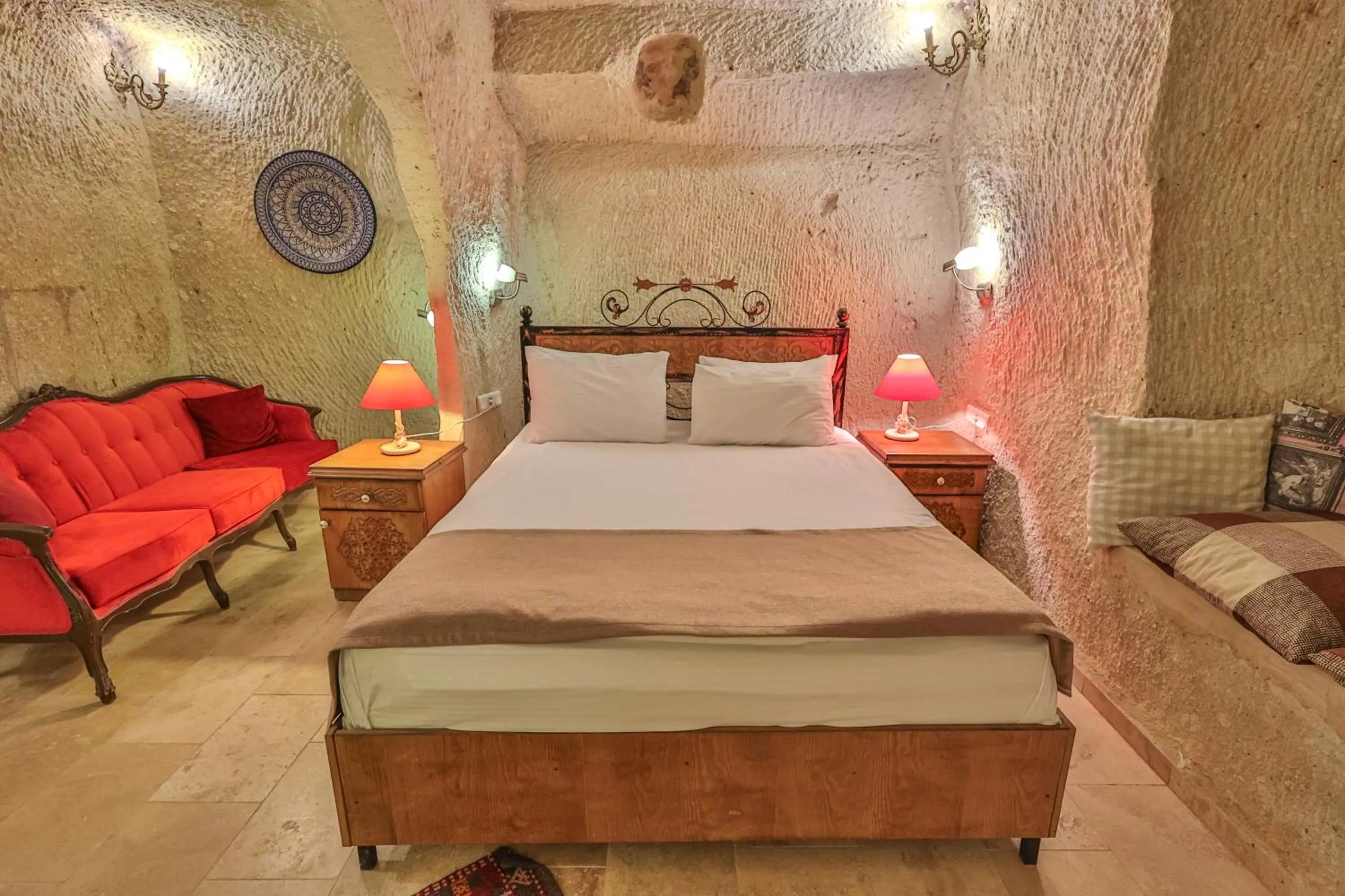 Bed in Bedrock Cave Hotel