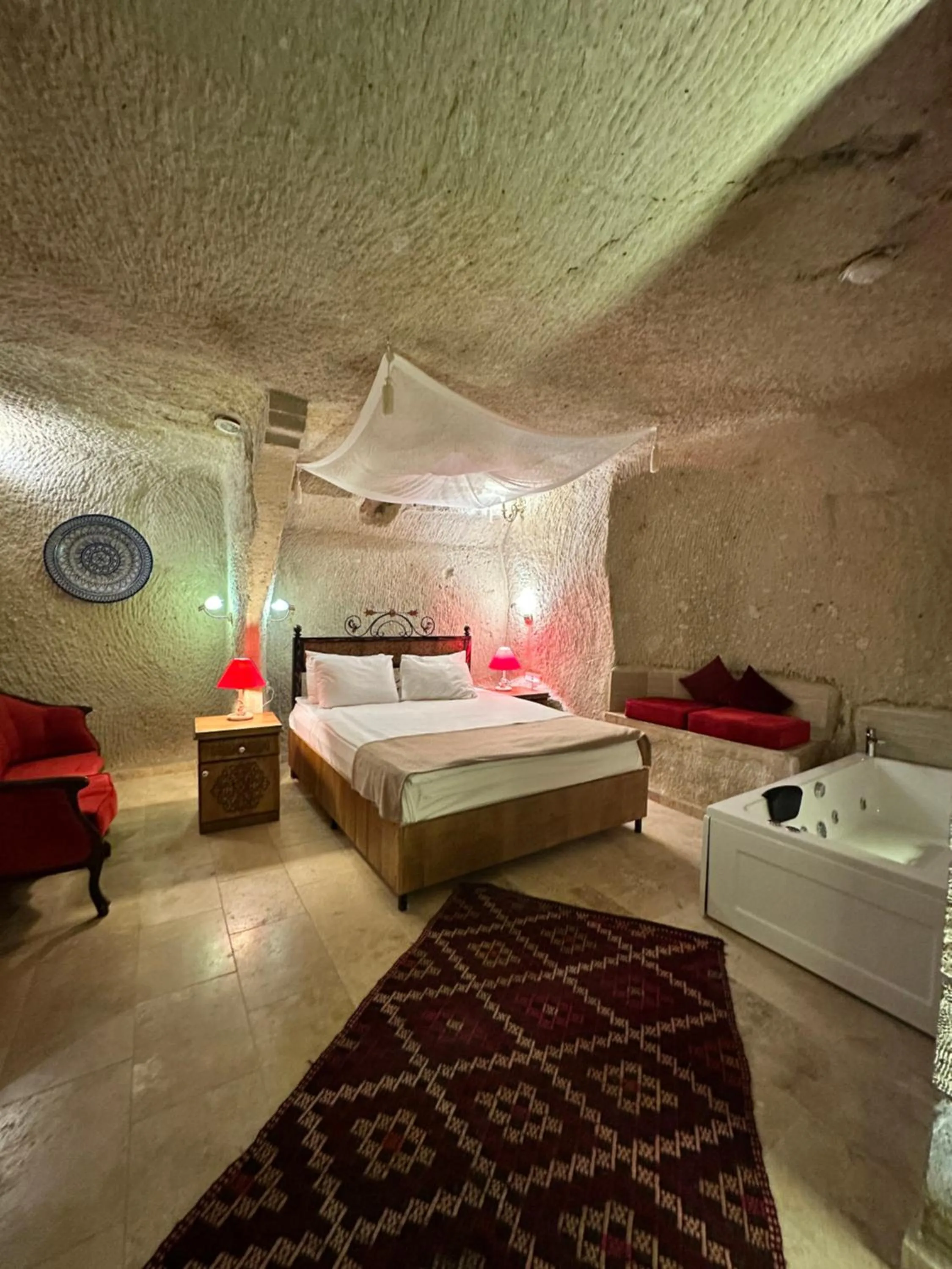 Bed in Bedrock Cave Hotel
