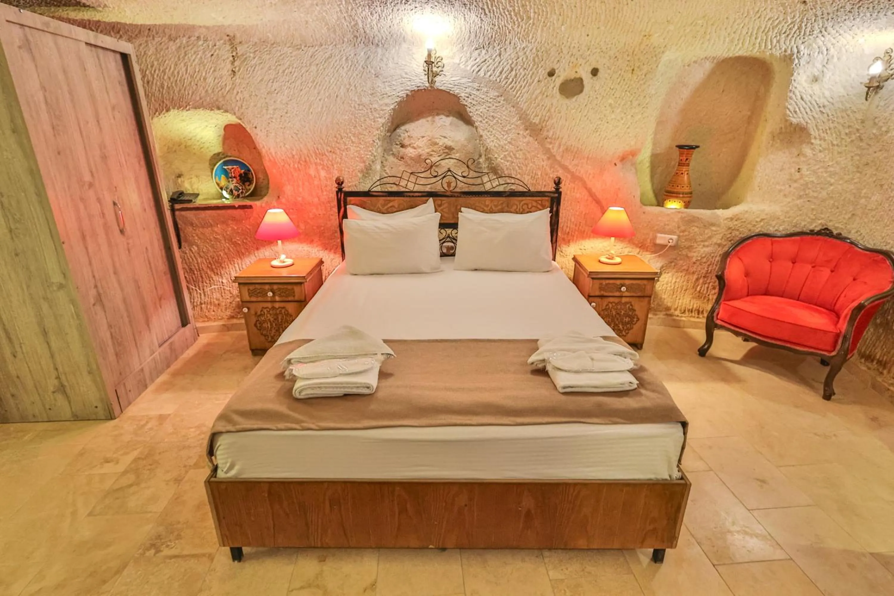 Bed in Bedrock Cave Hotel