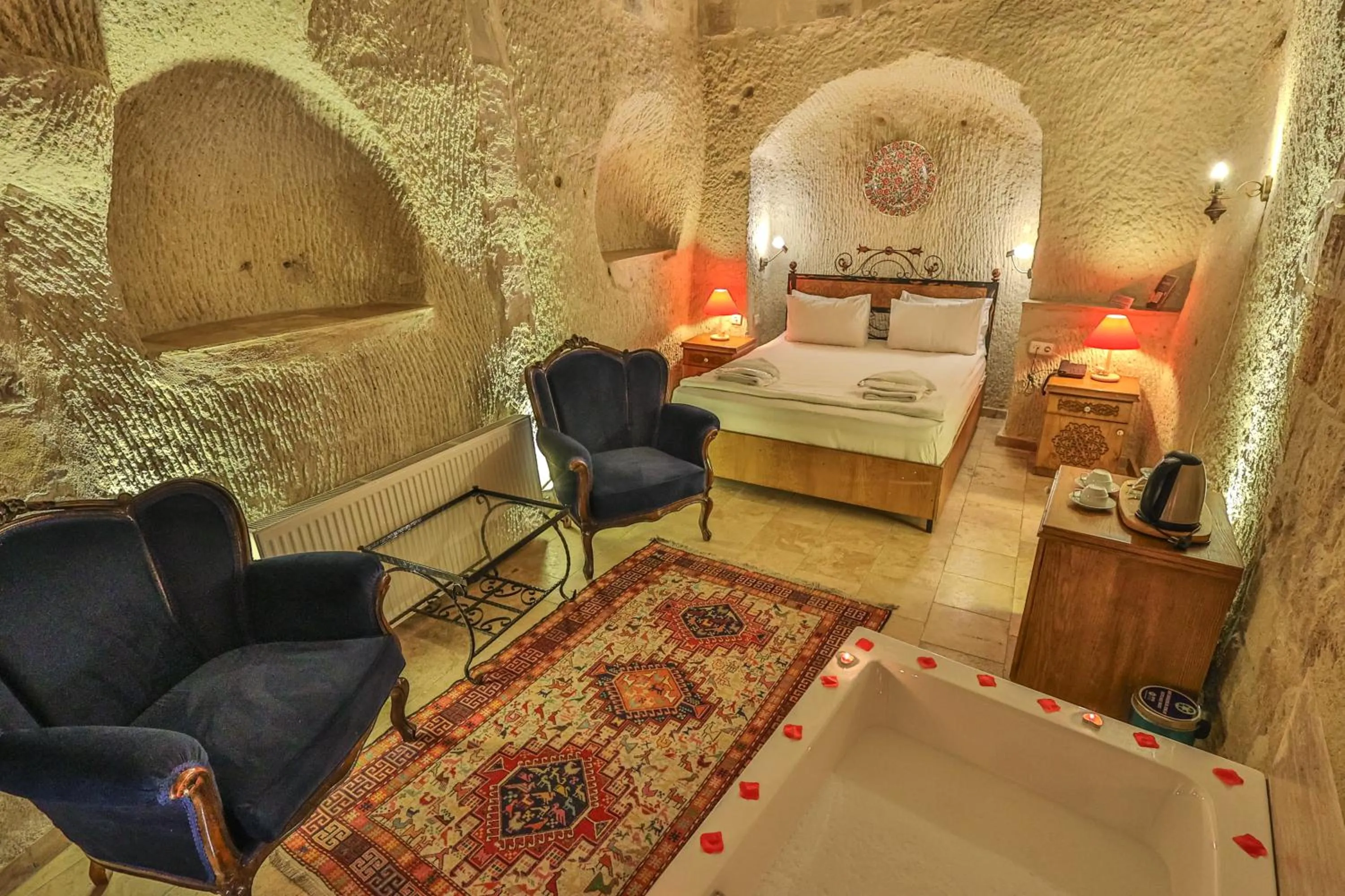 Bed in Bedrock Cave Hotel
