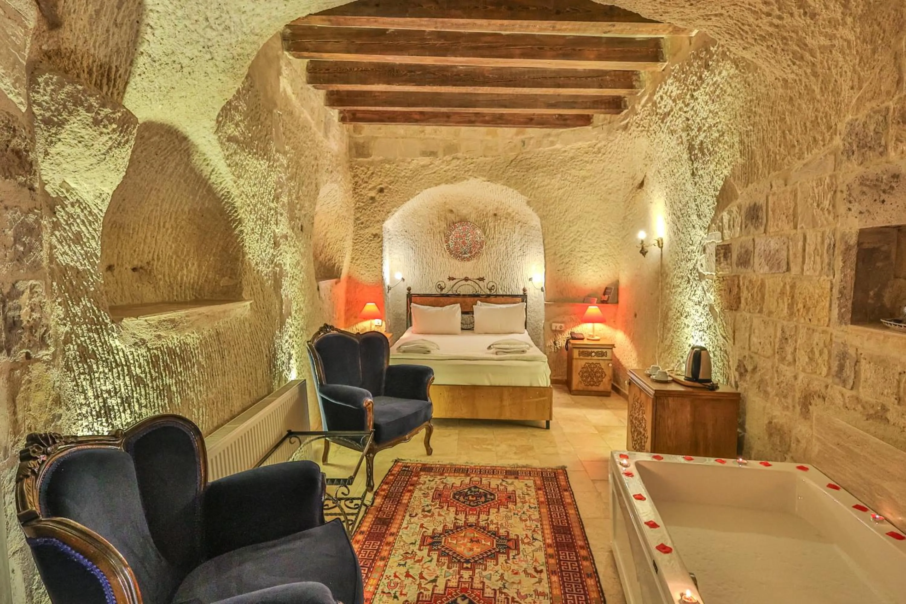 Bed in Bedrock Cave Hotel