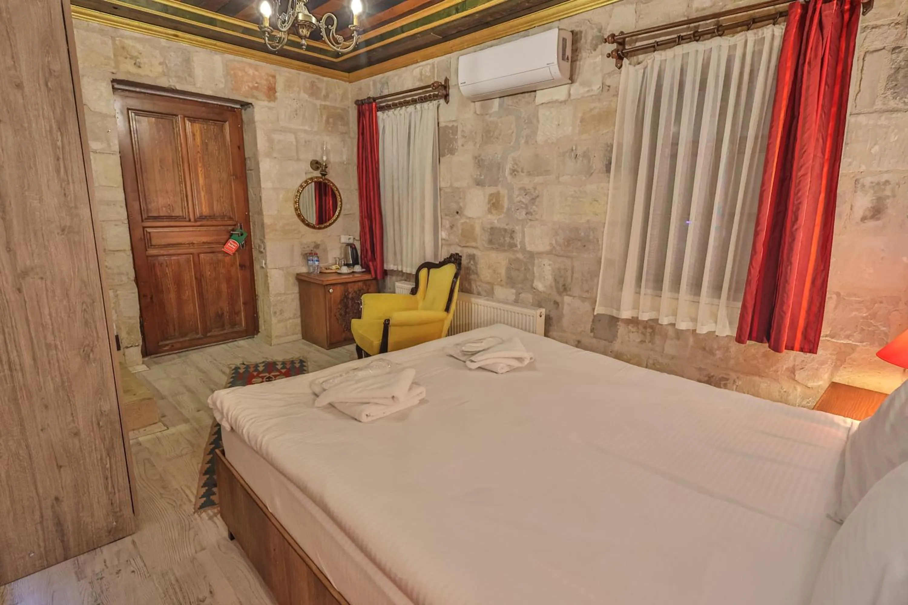 Bed in Bedrock Cave Hotel