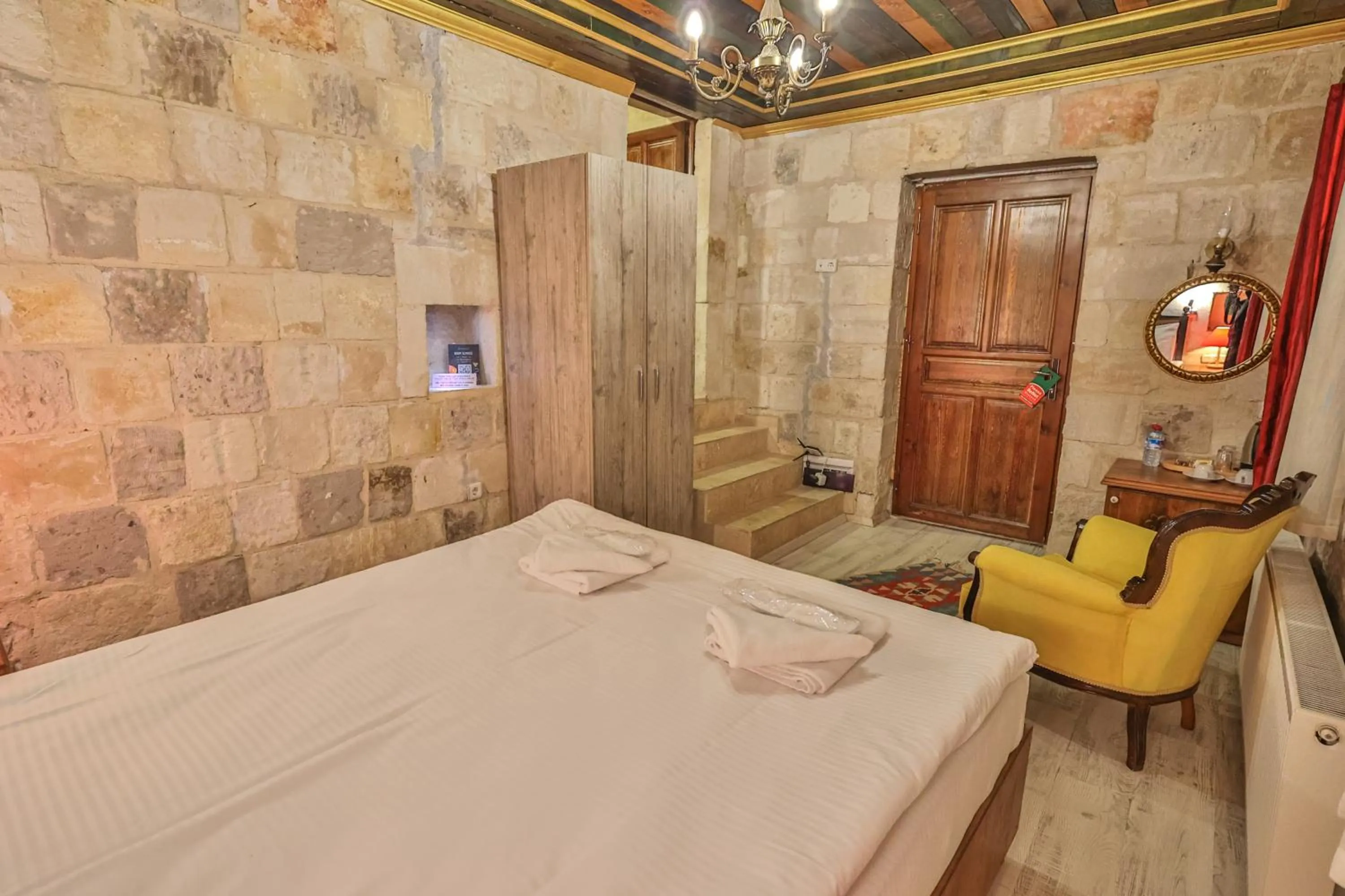 Bed in Bedrock Cave Hotel