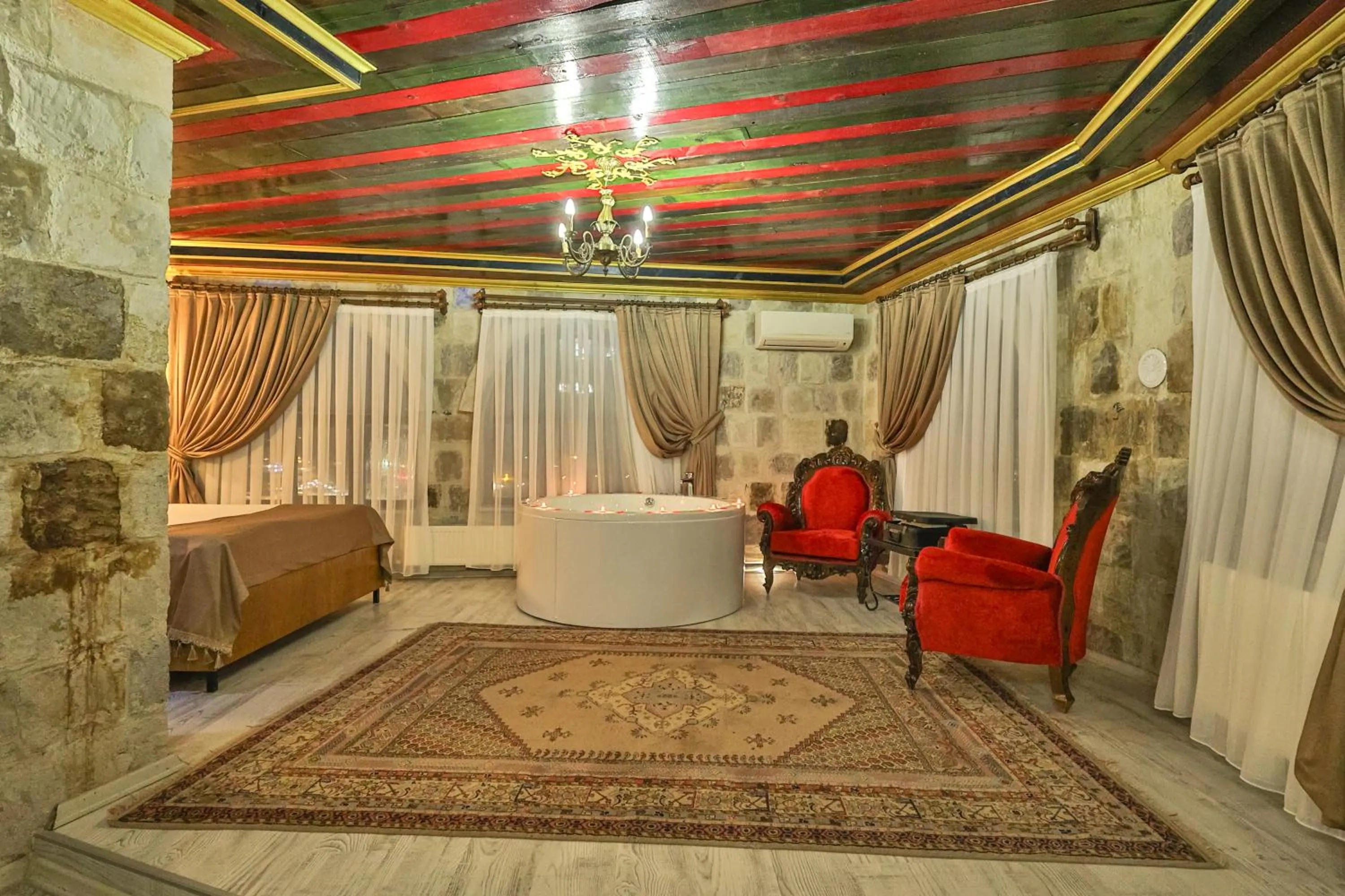 Hot Tub, Bed in Bedrock Cave Hotel