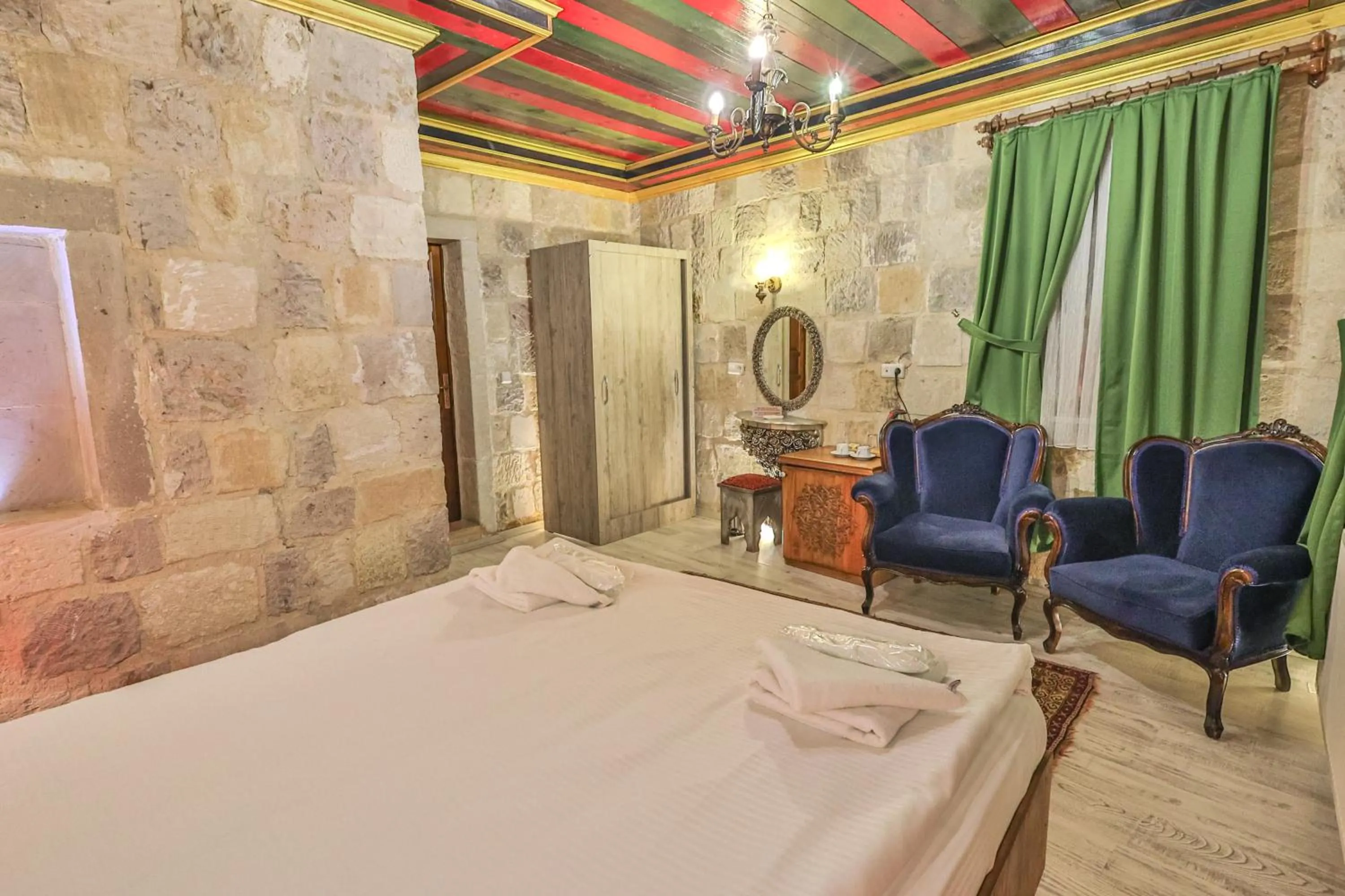 Bed in Bedrock Cave Hotel