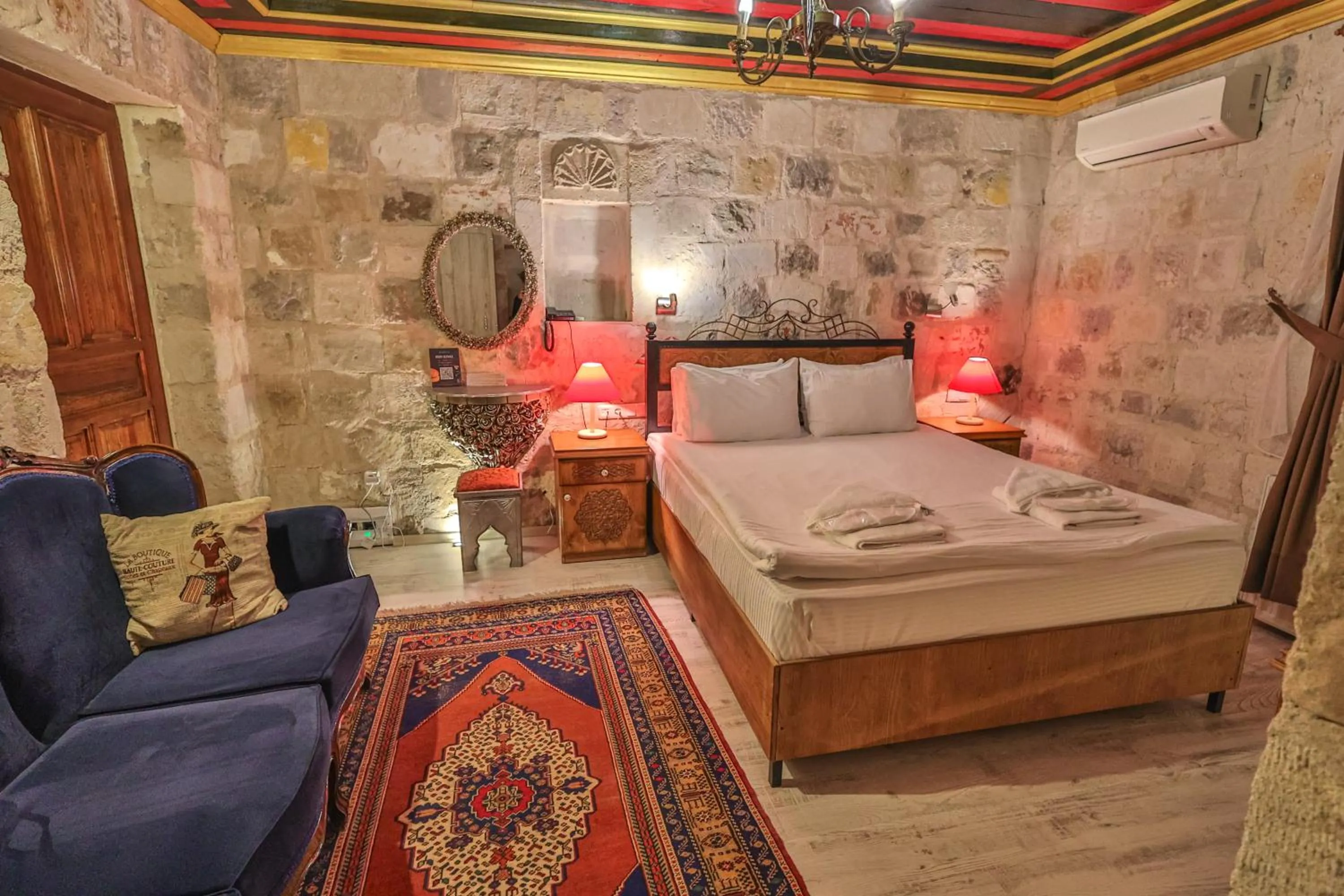 Bed in Bedrock Cave Hotel