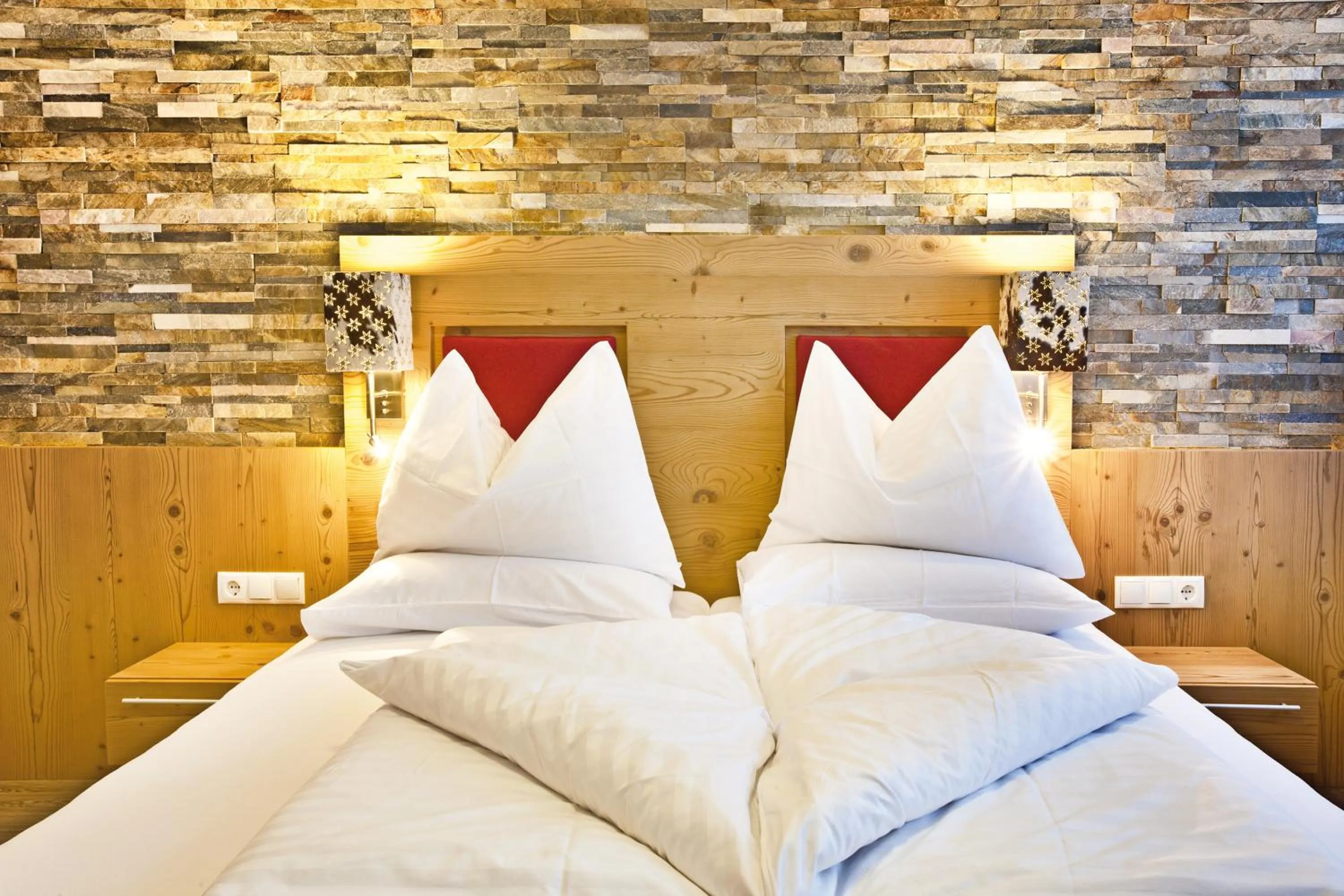 Photo of the whole room, Bed in Landhotel Alpenhof Filzmoos