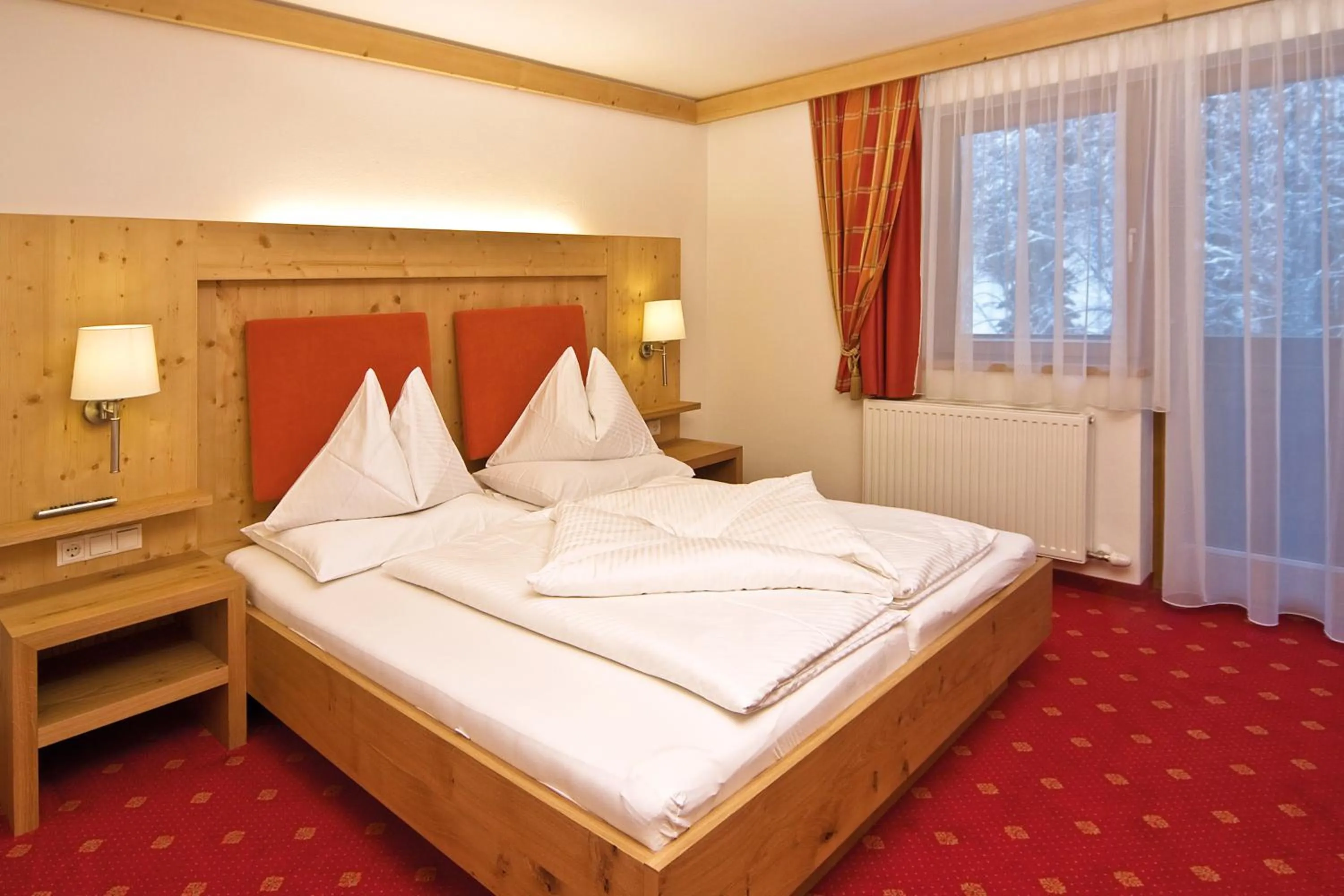 Photo of the whole room, Bed in Landhotel Alpenhof Filzmoos