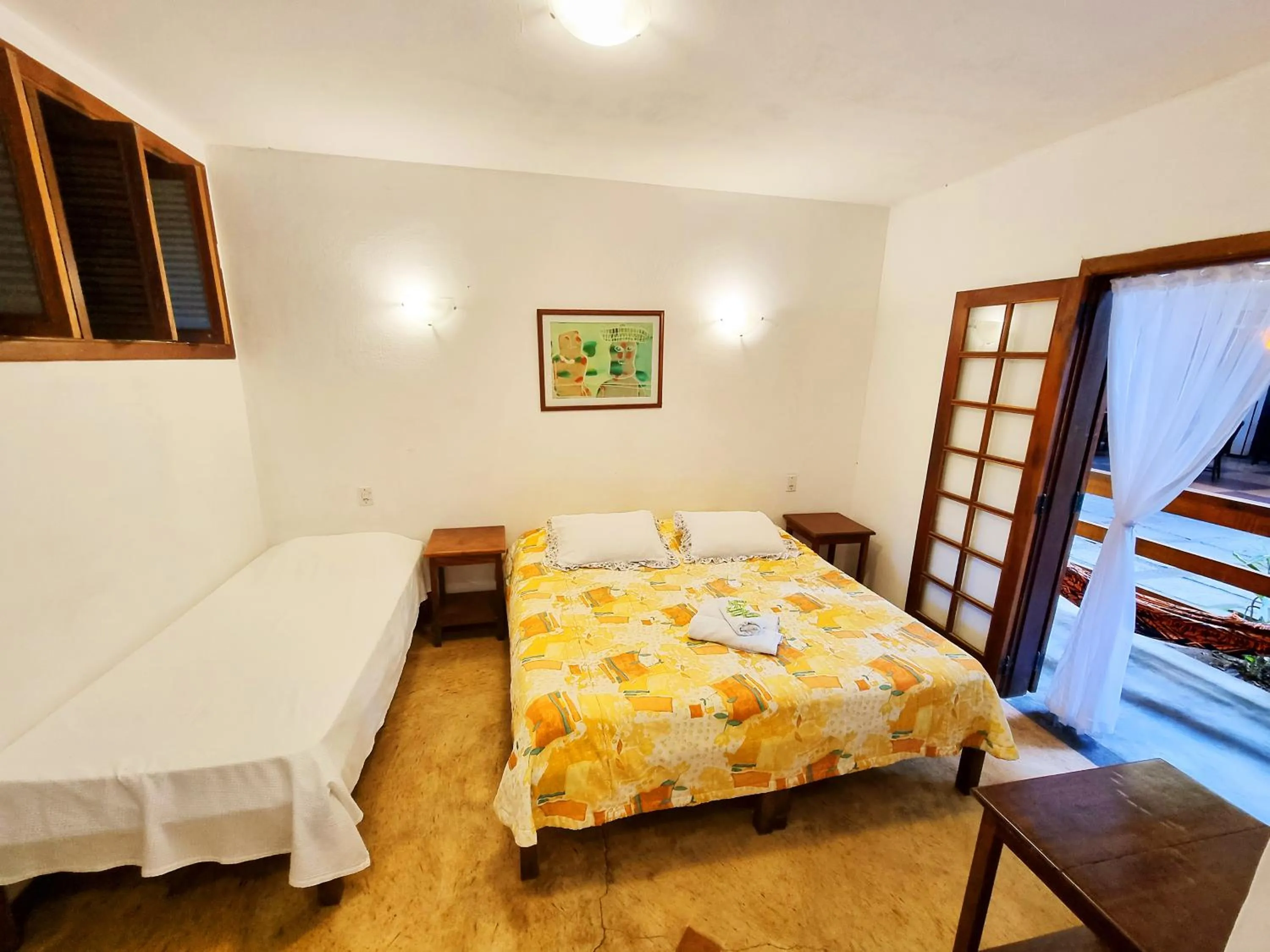 Bed in Pousada Rumo dos Ventos