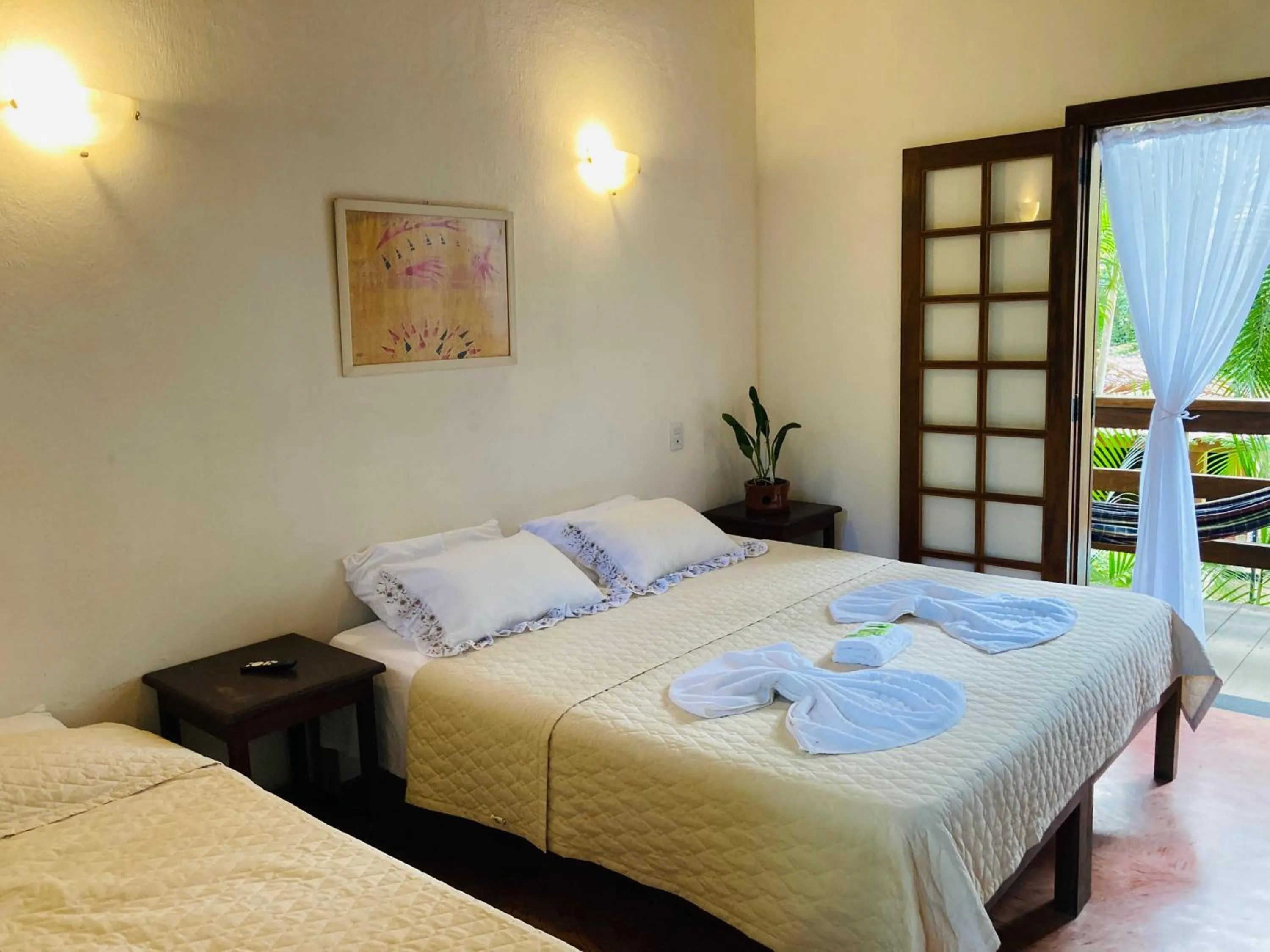 Bed in Pousada Rumo dos Ventos