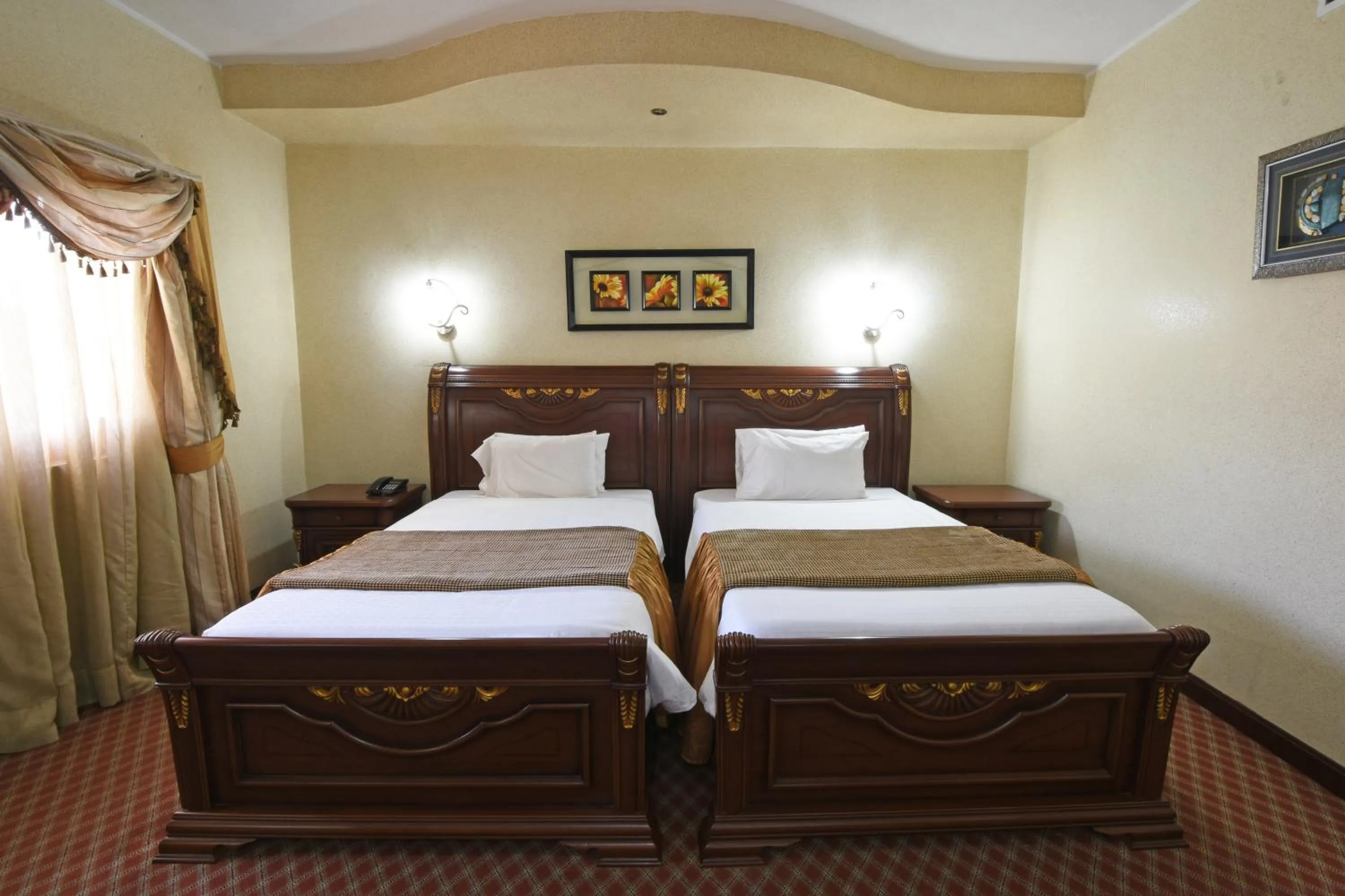 Bed in Imperial Royale Hotel