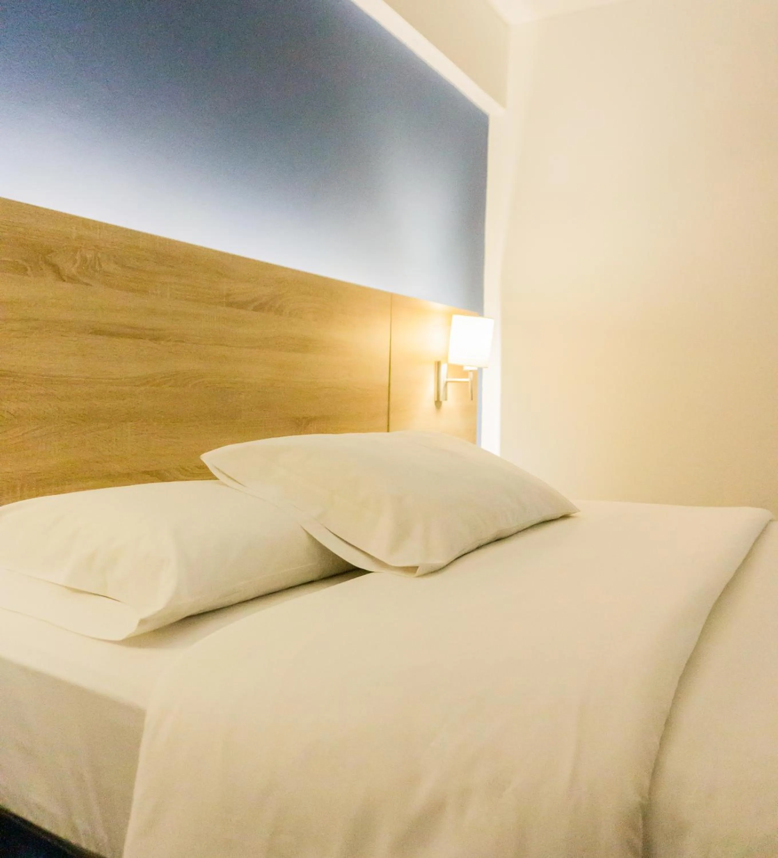 Bed in Daniel's Apart Hotel