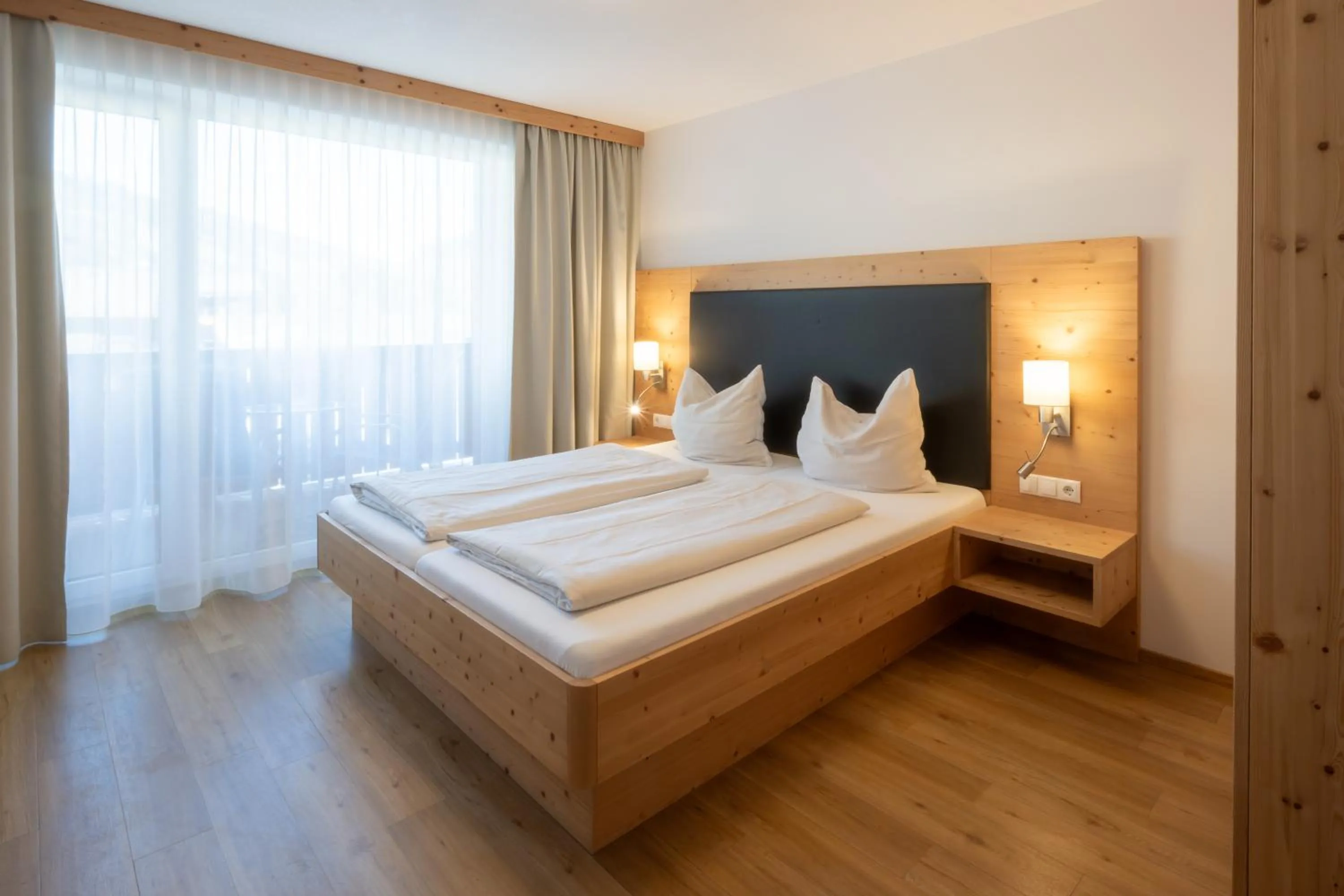 Photo of the whole room, Bed in Familienhotel Botenwirt