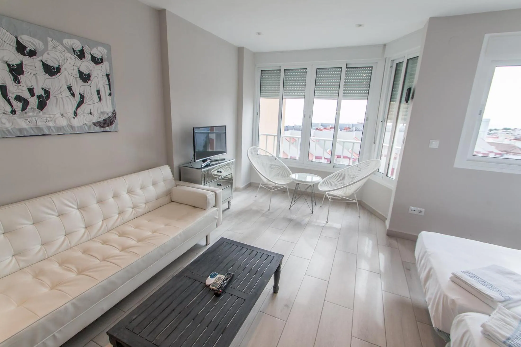 Living room, Bed in Palm Beach Club Apartamentos Carihuela