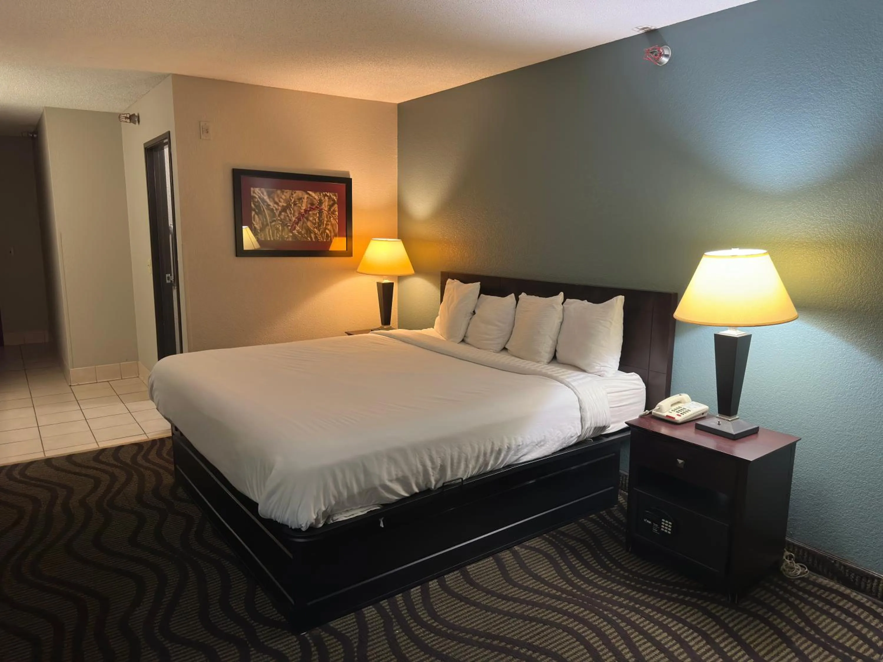 Bed in Baymont Inn & Suites by Wyndham Lincoln NE