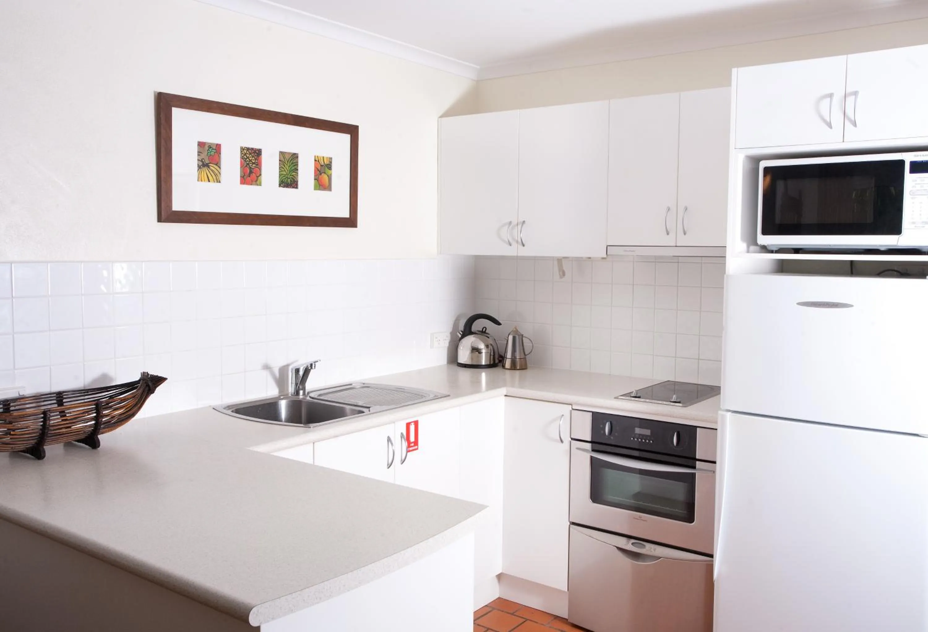 Kitchen or kitchenette in Coral Sea Villas