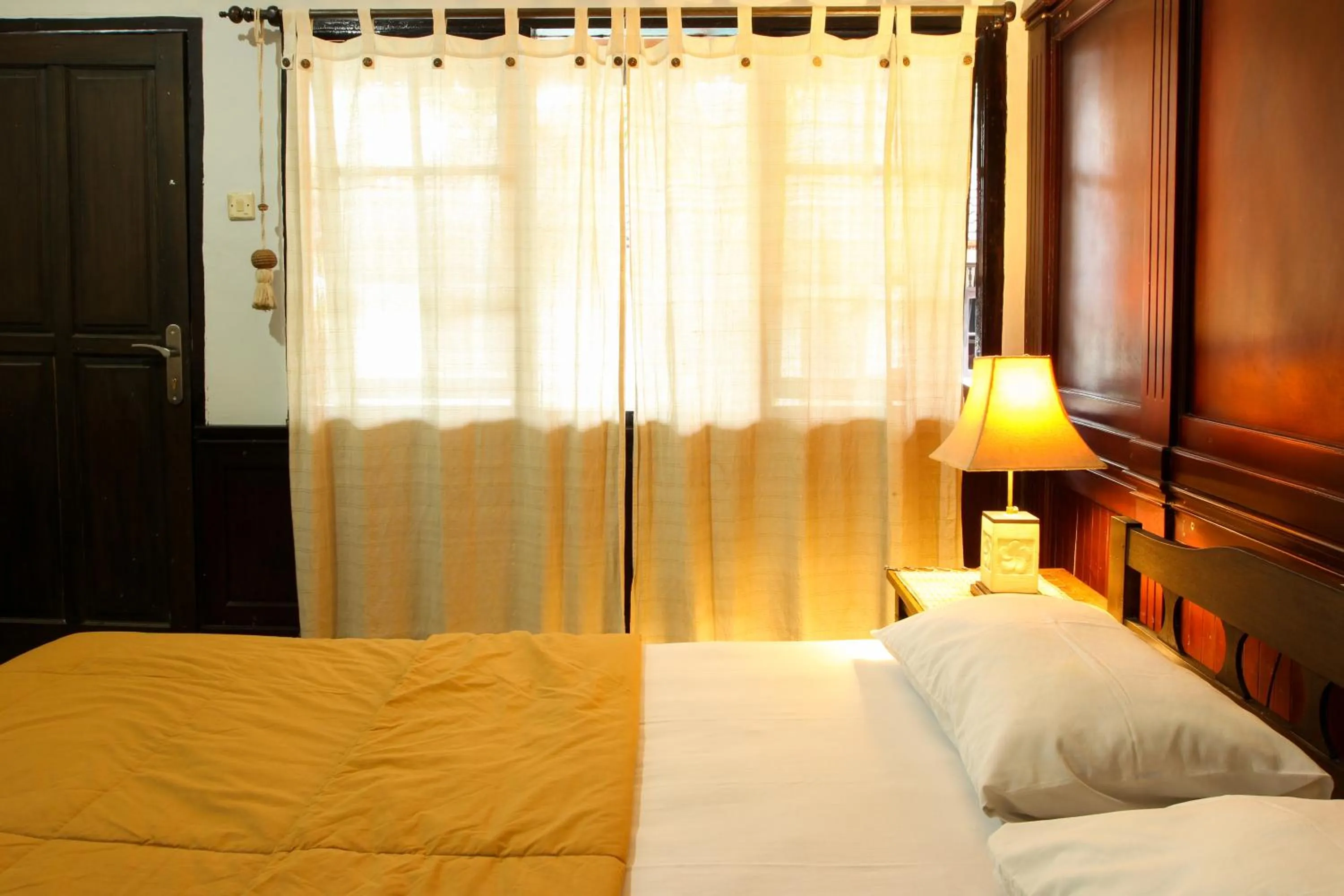 Bed in Sari Indah Cottages