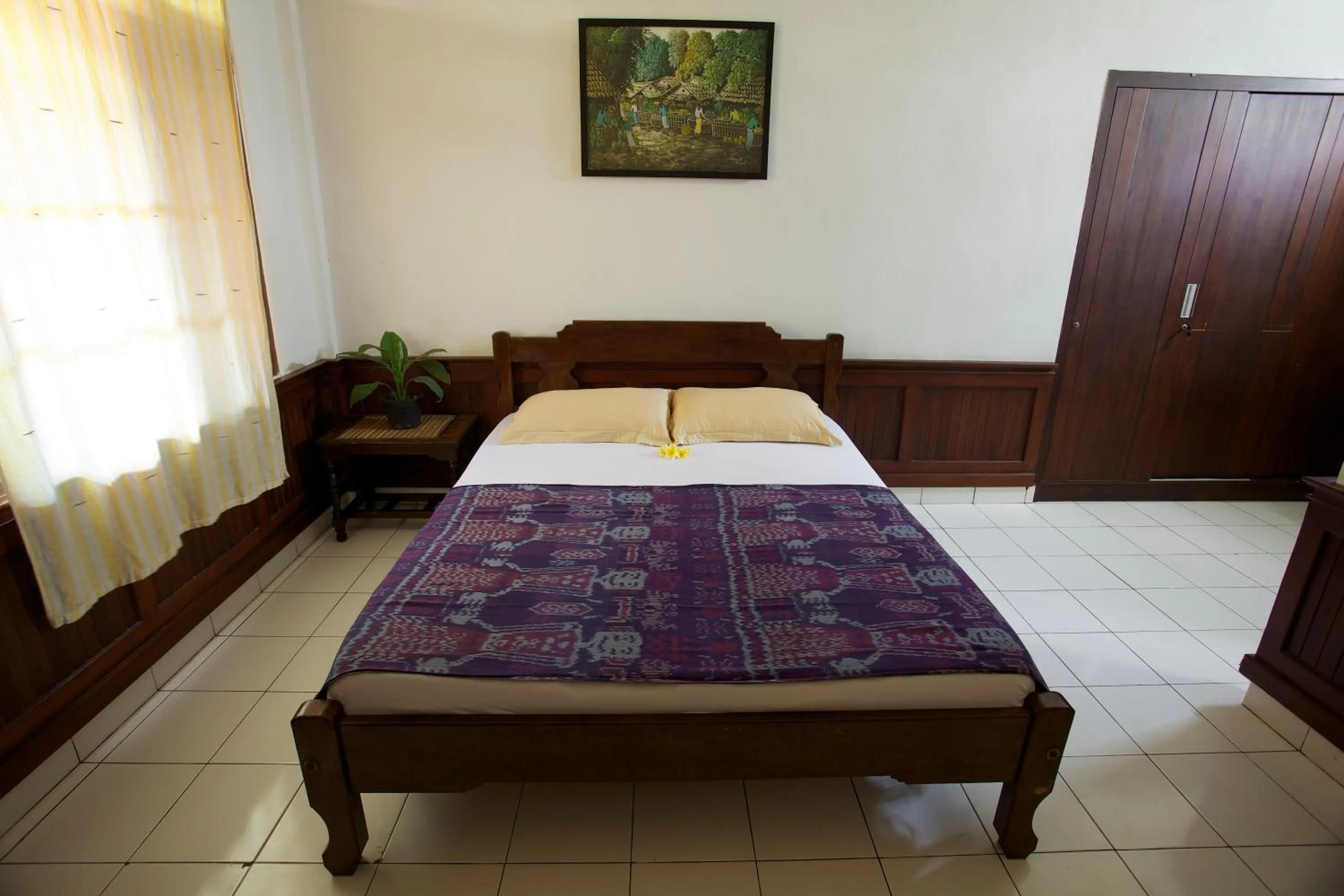 Bed in Sari Indah Cottages