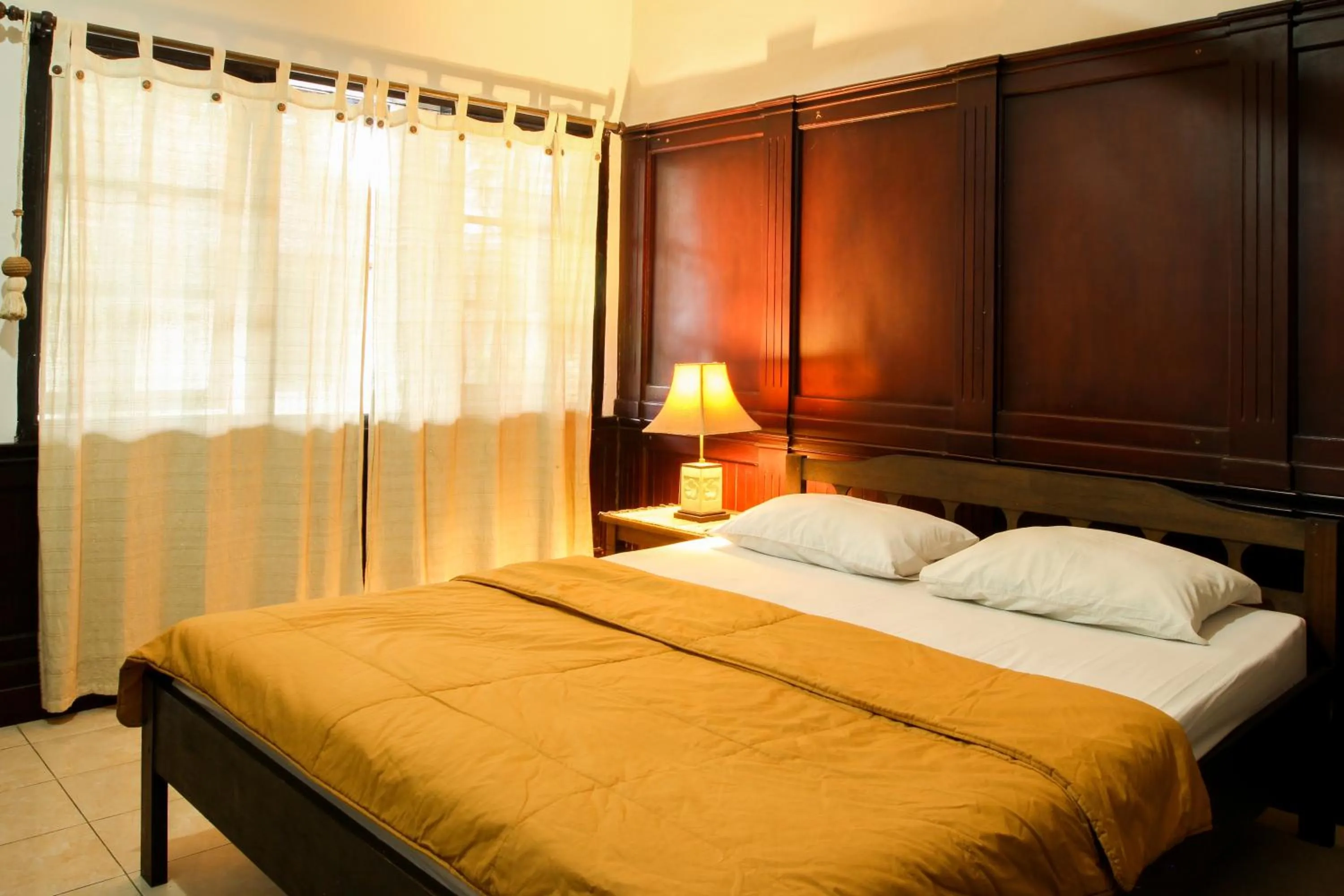 Bed in Sari Indah Cottages