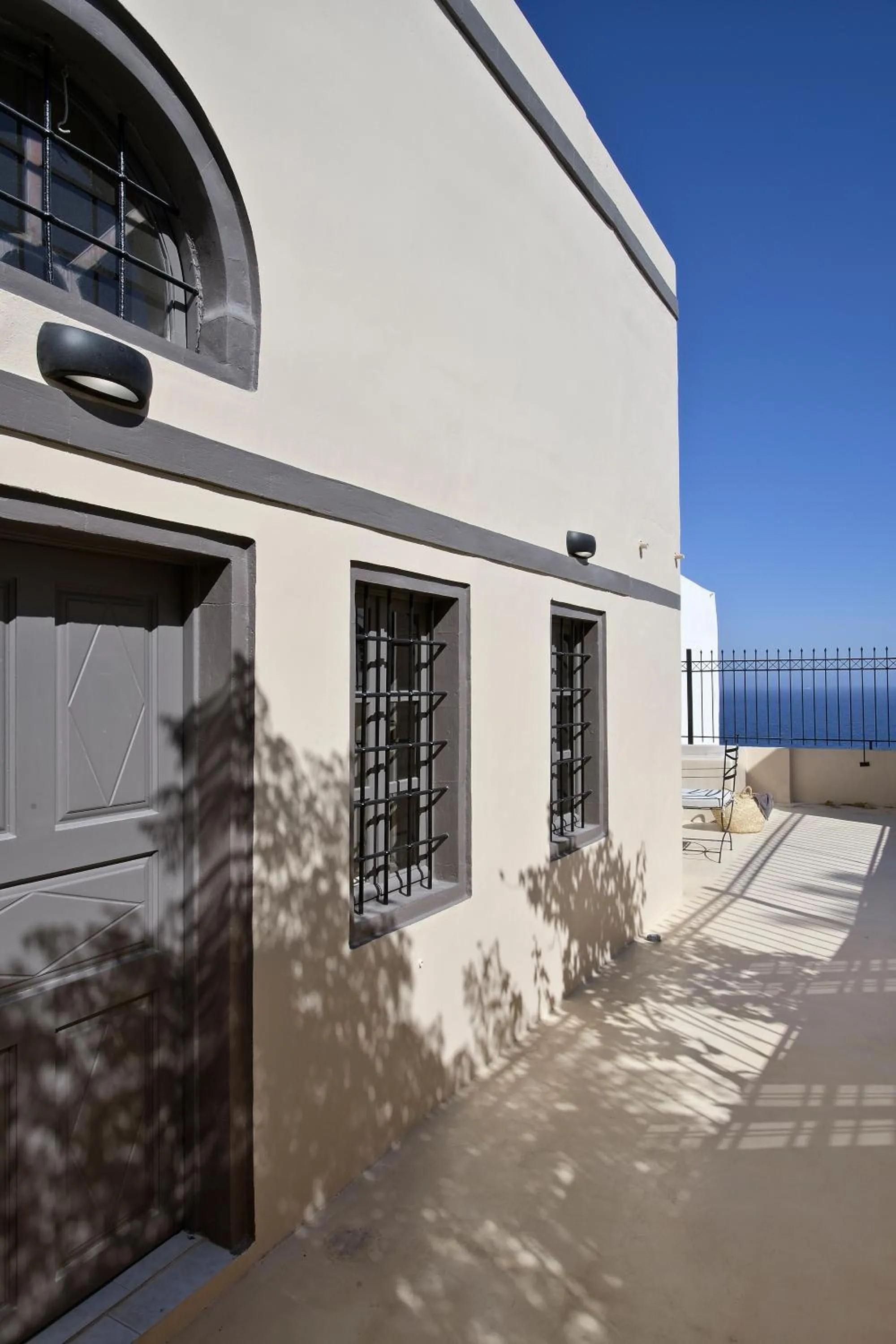 Facade/entrance in OIA UNIQUE HOMES by K&K