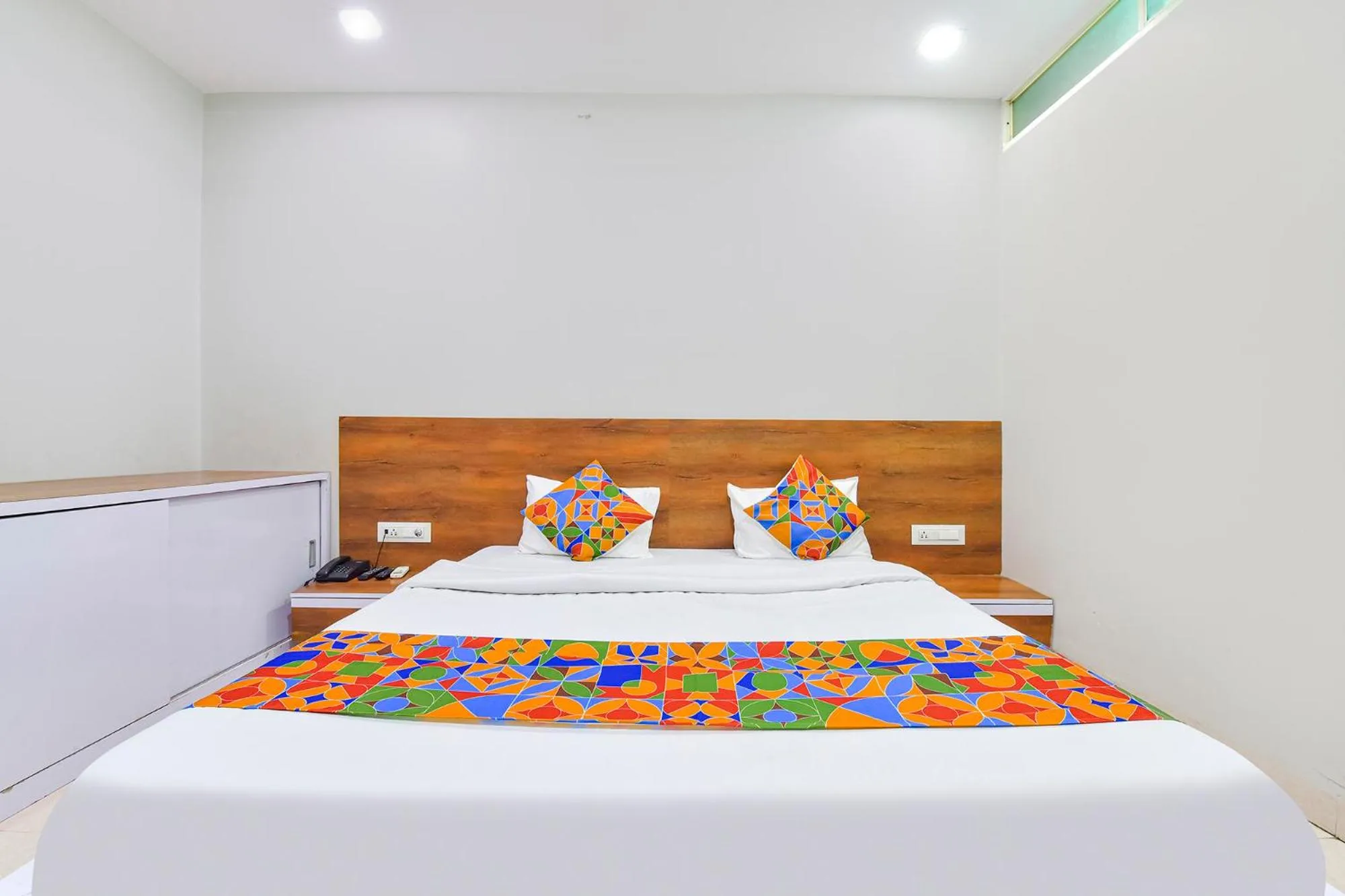 Bed in FabHotel Raghumani Palace