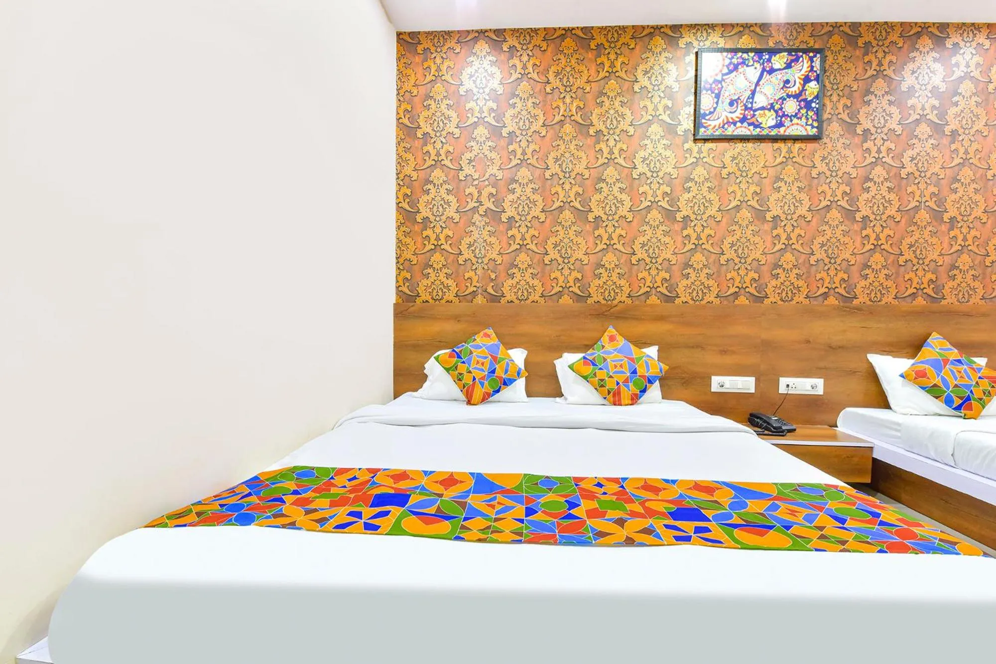 Bed in FabHotel Raghumani Palace