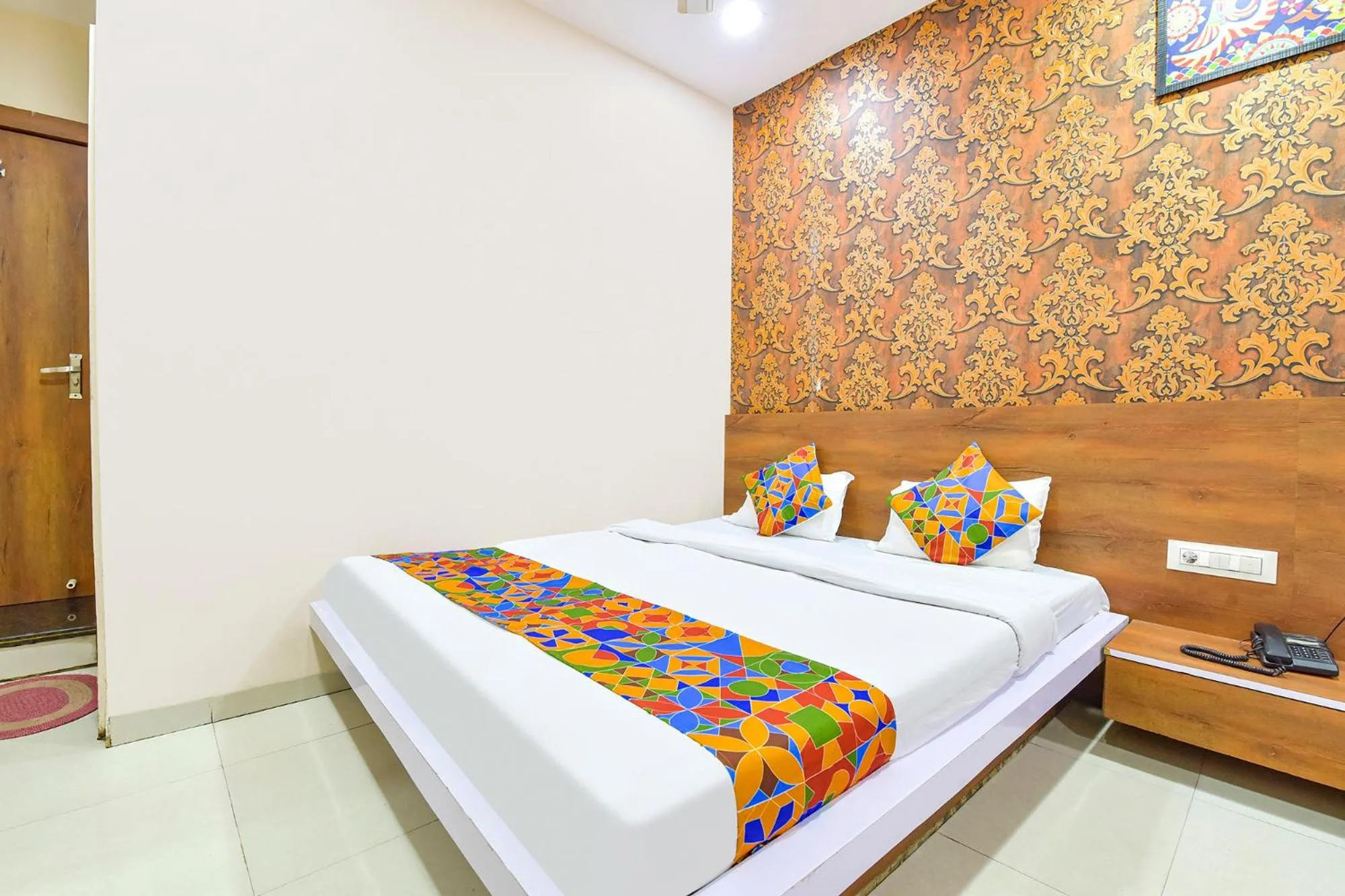 Bed in FabHotel Raghumani Palace