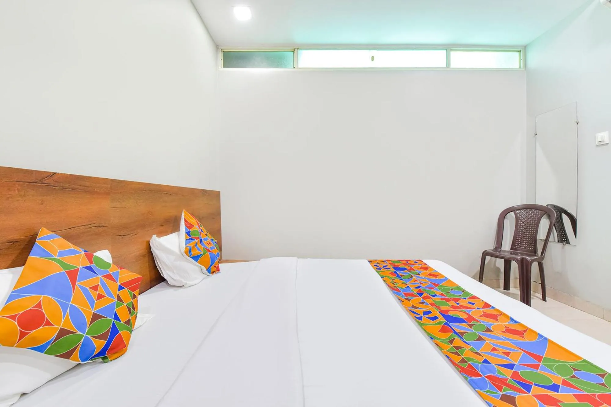 Bed in FabHotel Raghumani Palace