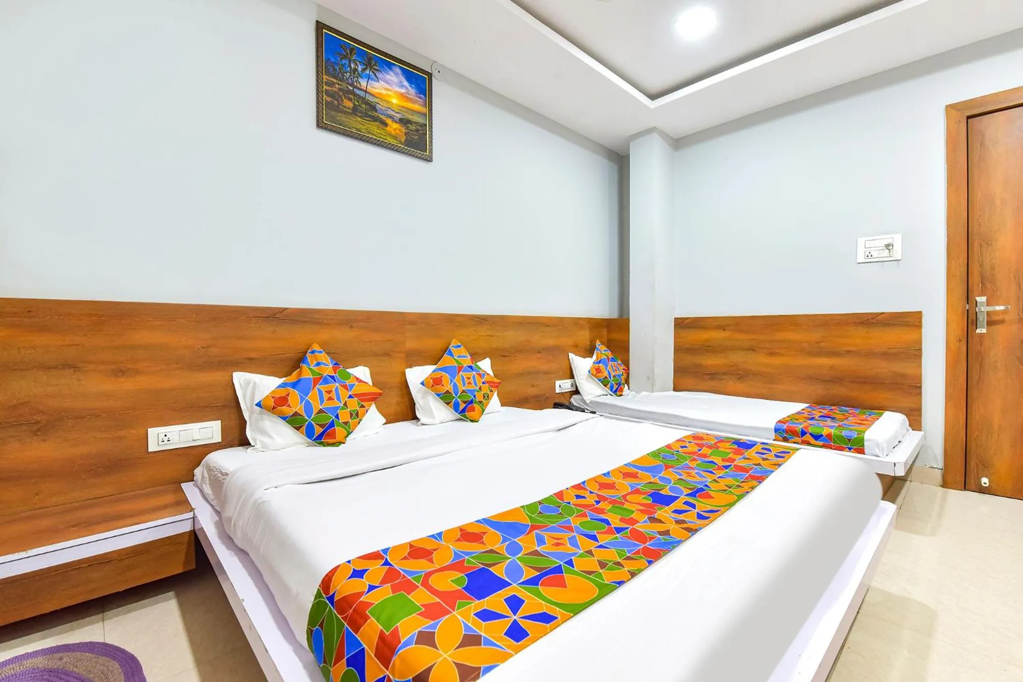 Bed in FabHotel Raghumani Palace