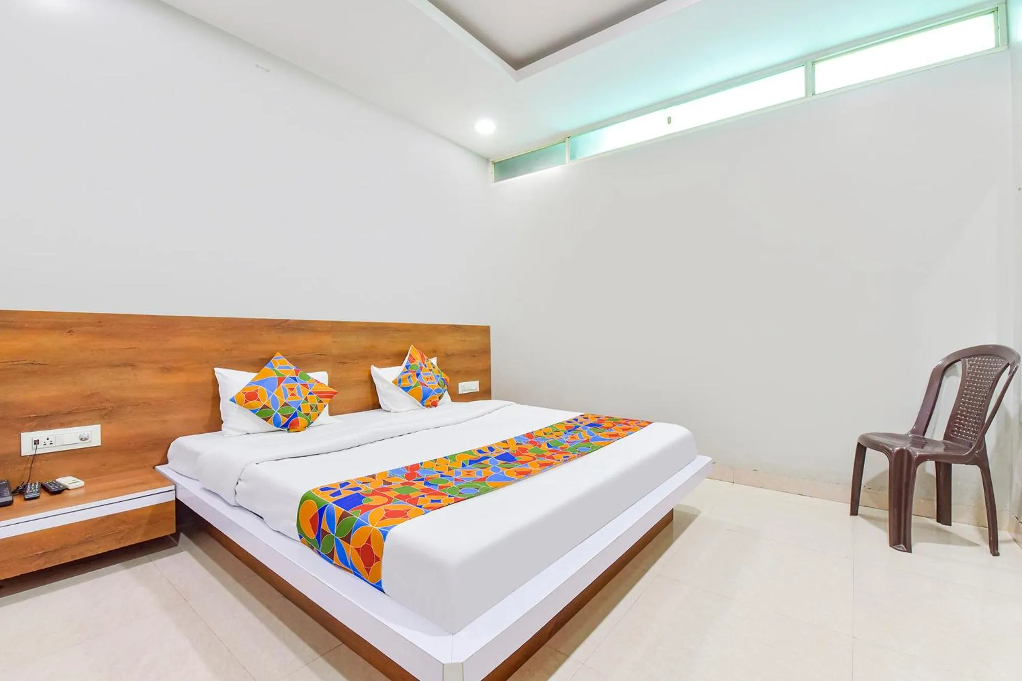 Bed in FabHotel Raghumani Palace