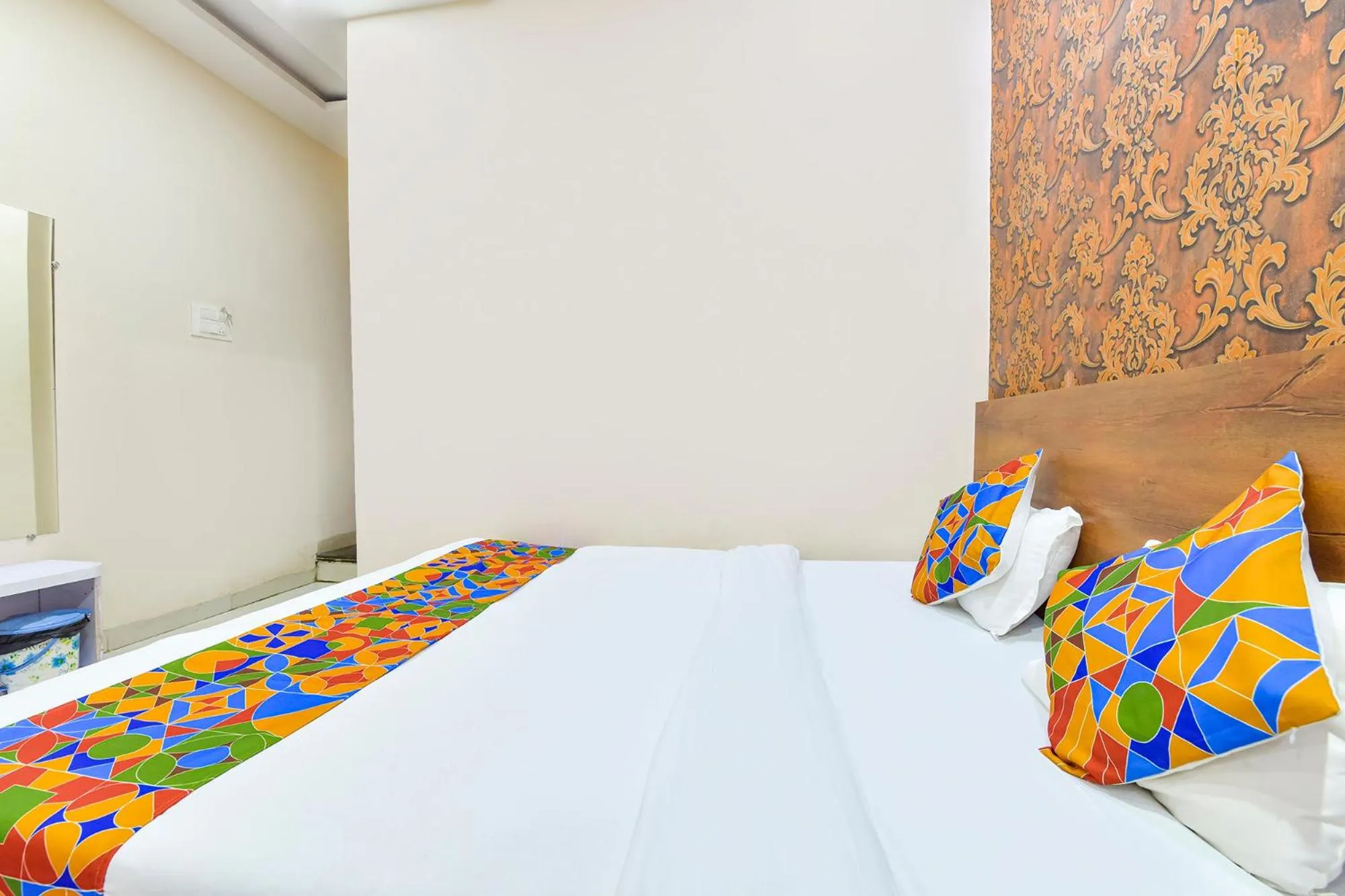 Bed in FabHotel Raghumani Palace