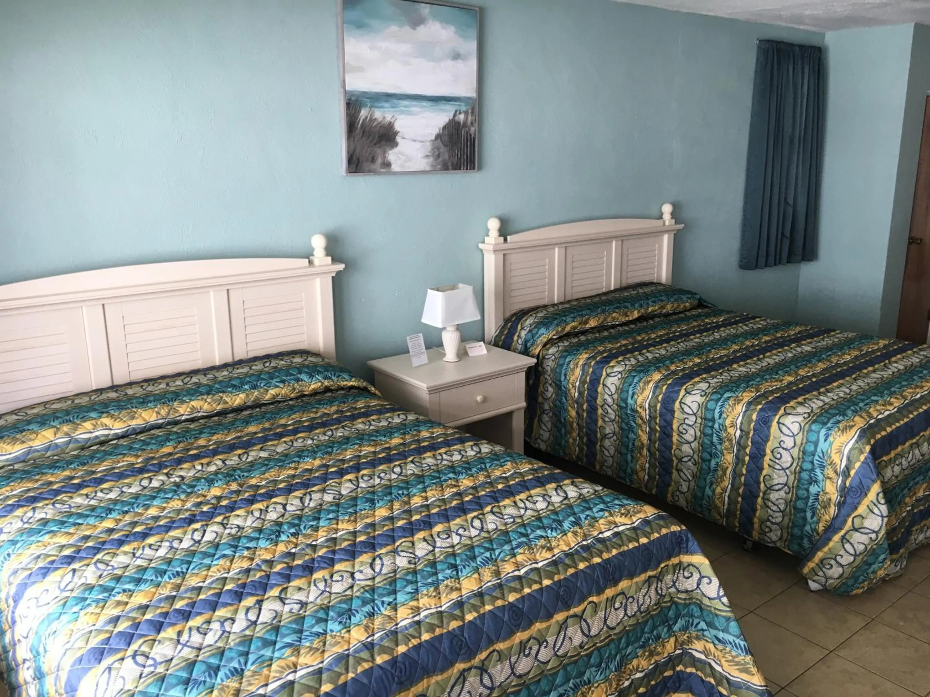 Bed in Beach Colony Motel