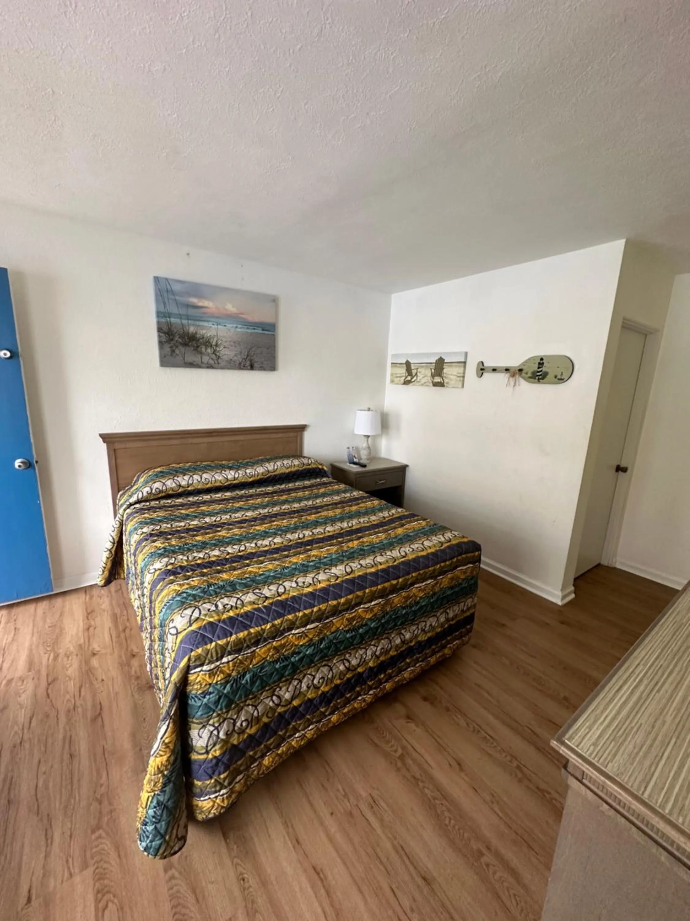 Bed in Beach Colony Motel