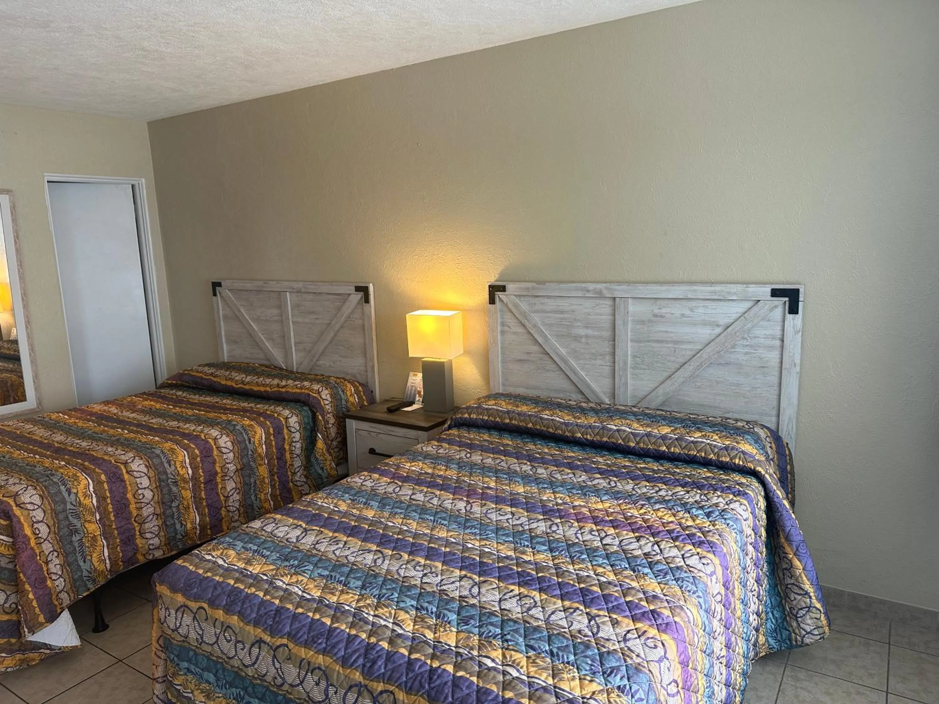 Bed in Beach Colony Motel