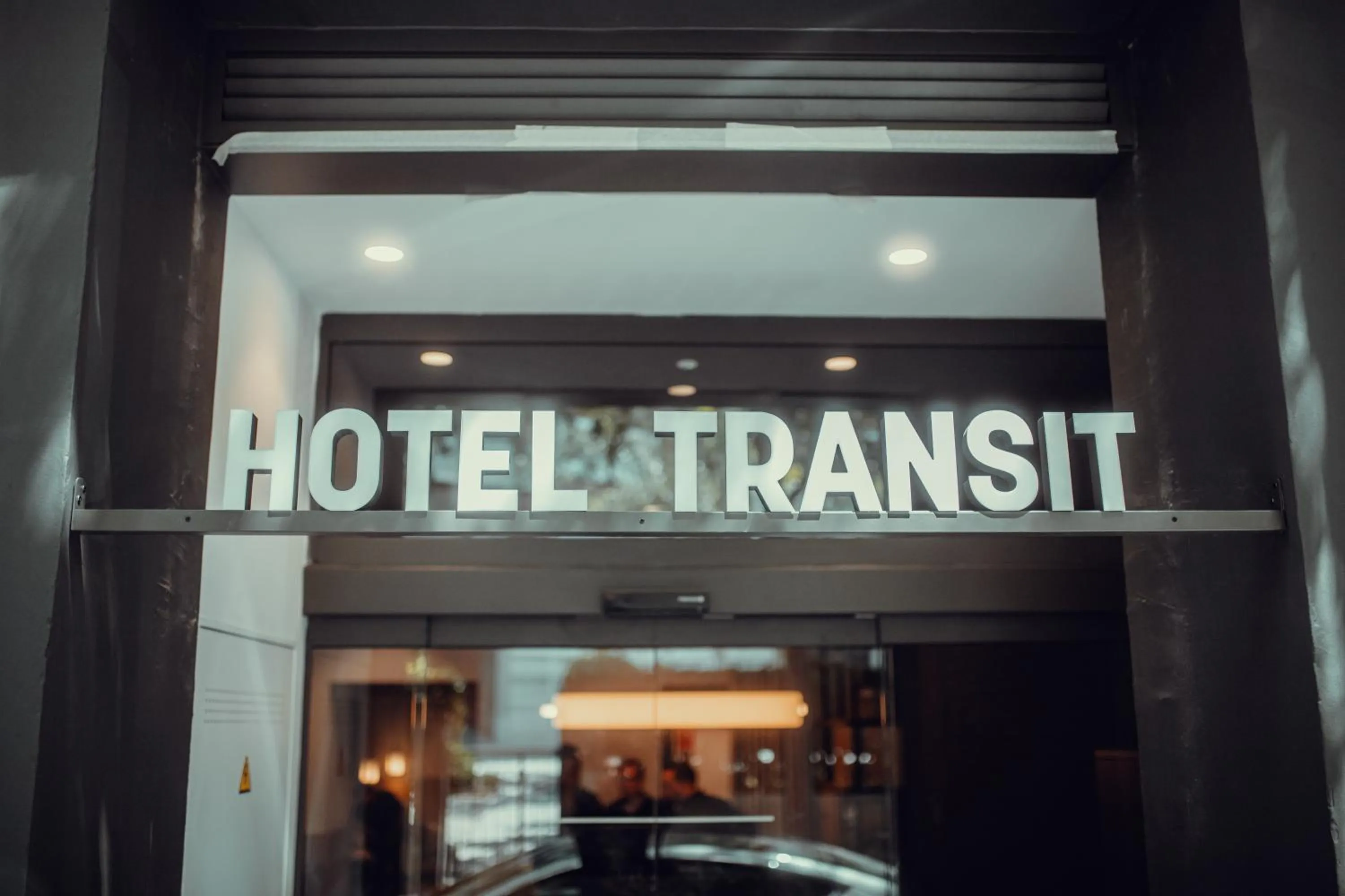 Property logo or sign in Hotel Transit