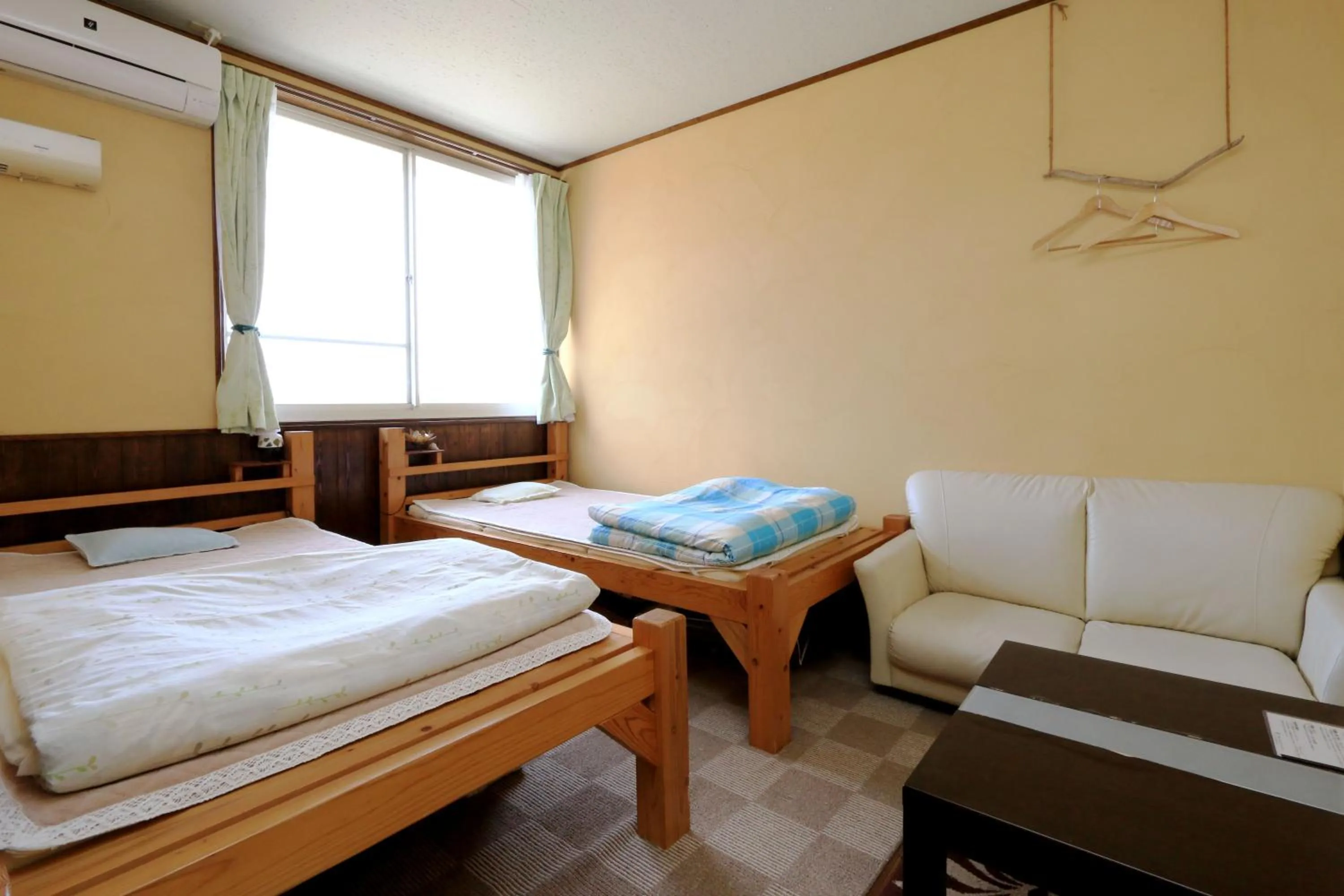 Photo of the whole room, Bed in Tanegashima Minshuku Yuyu