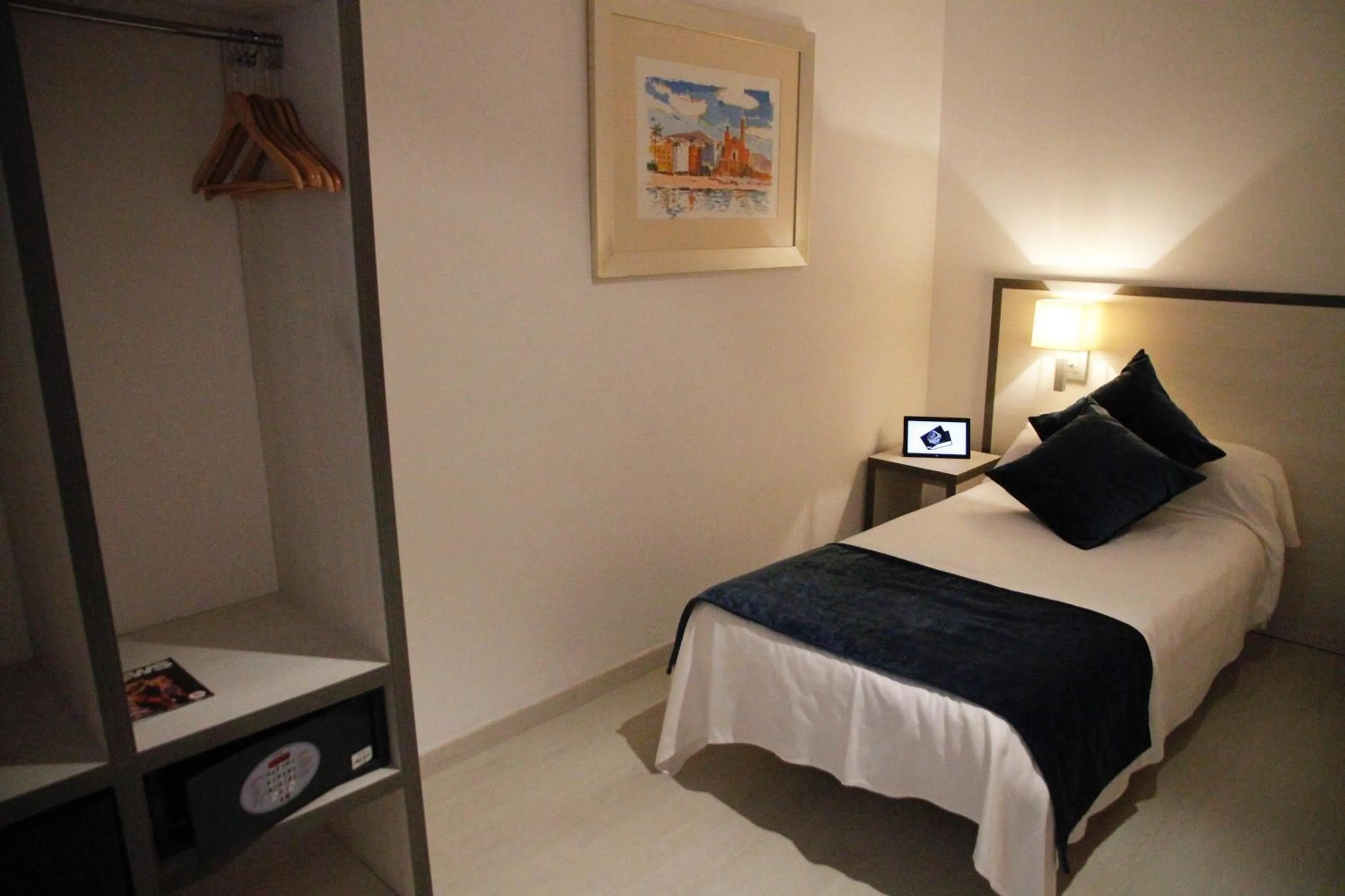 Bed in Parrots Sitges Hotel