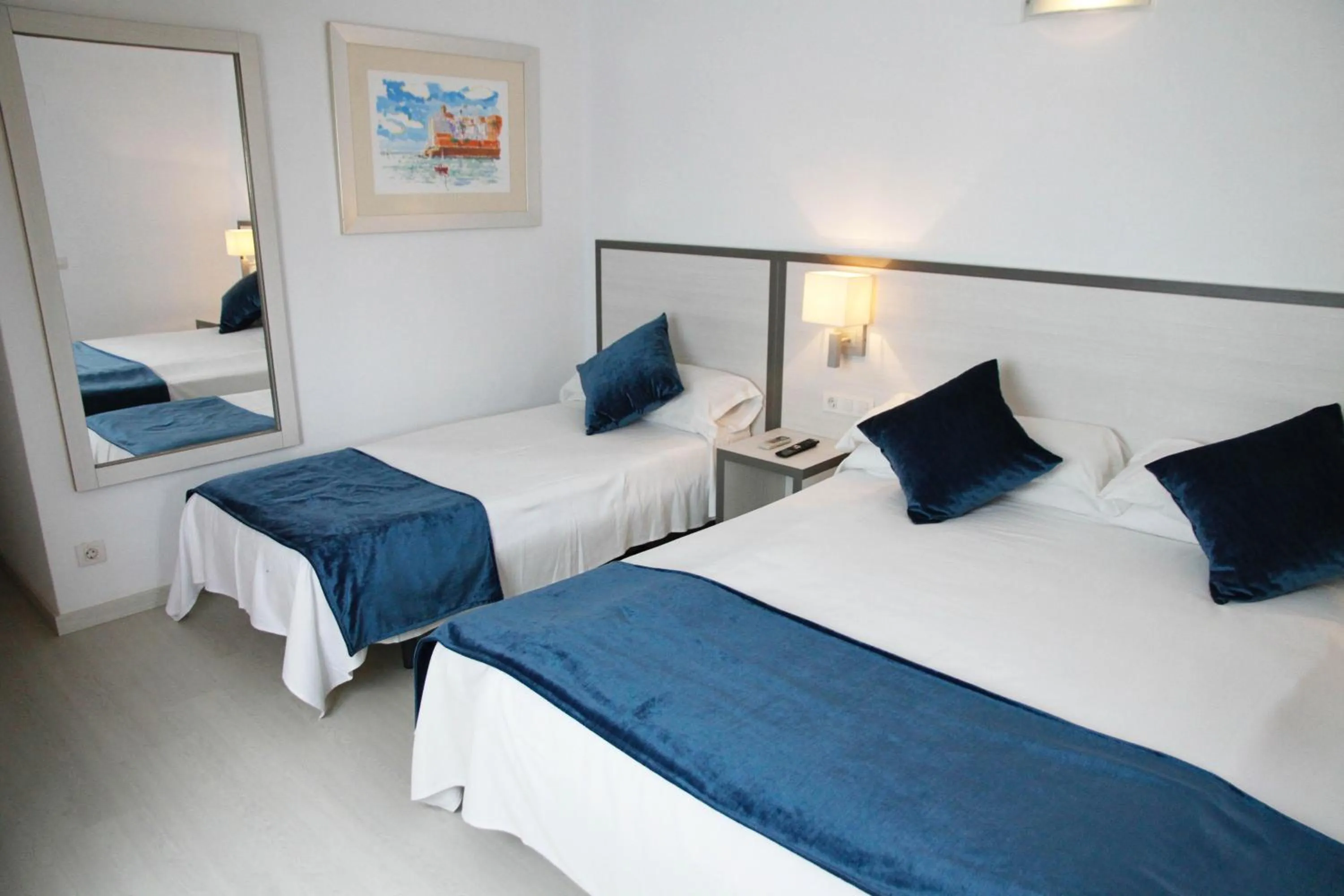 Bed in Parrots Sitges Hotel