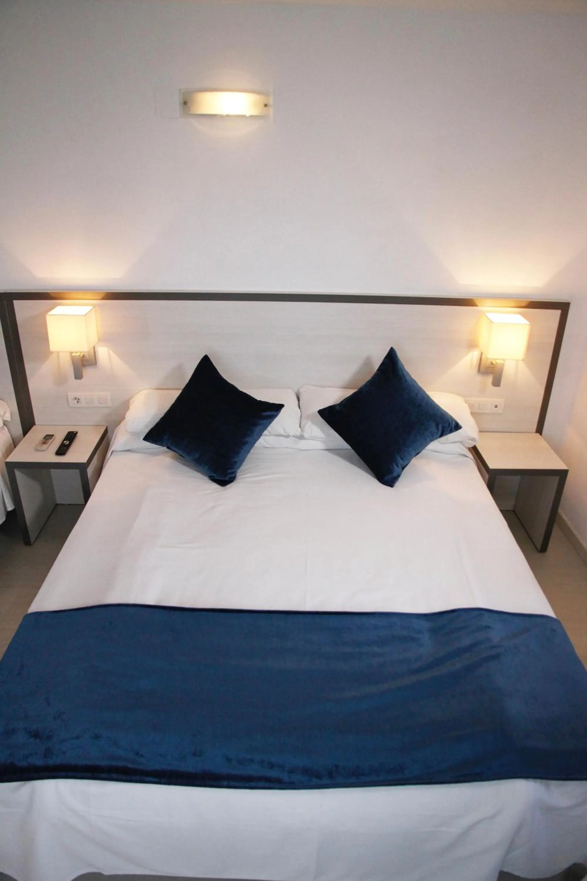 Bed in Parrots Sitges Hotel