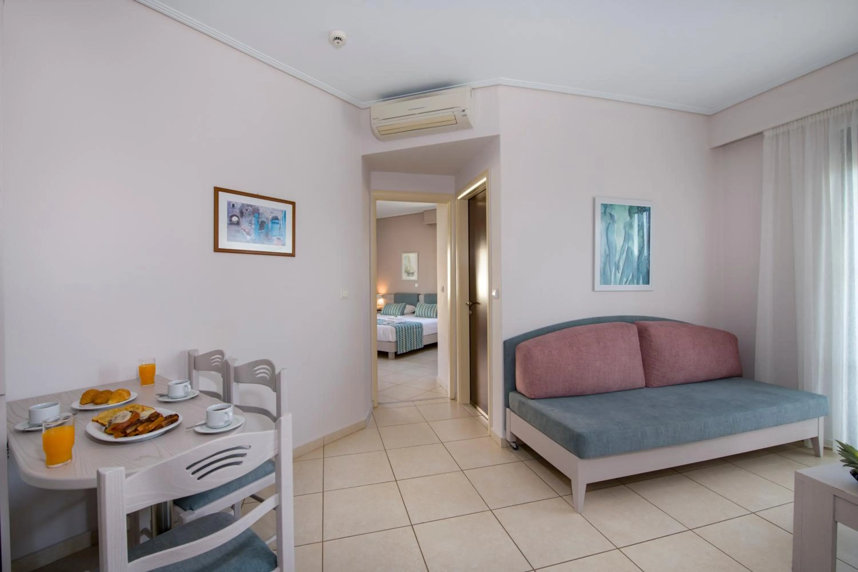 Seating area, Bed in Creta Palm Resort Hotel & Apartments