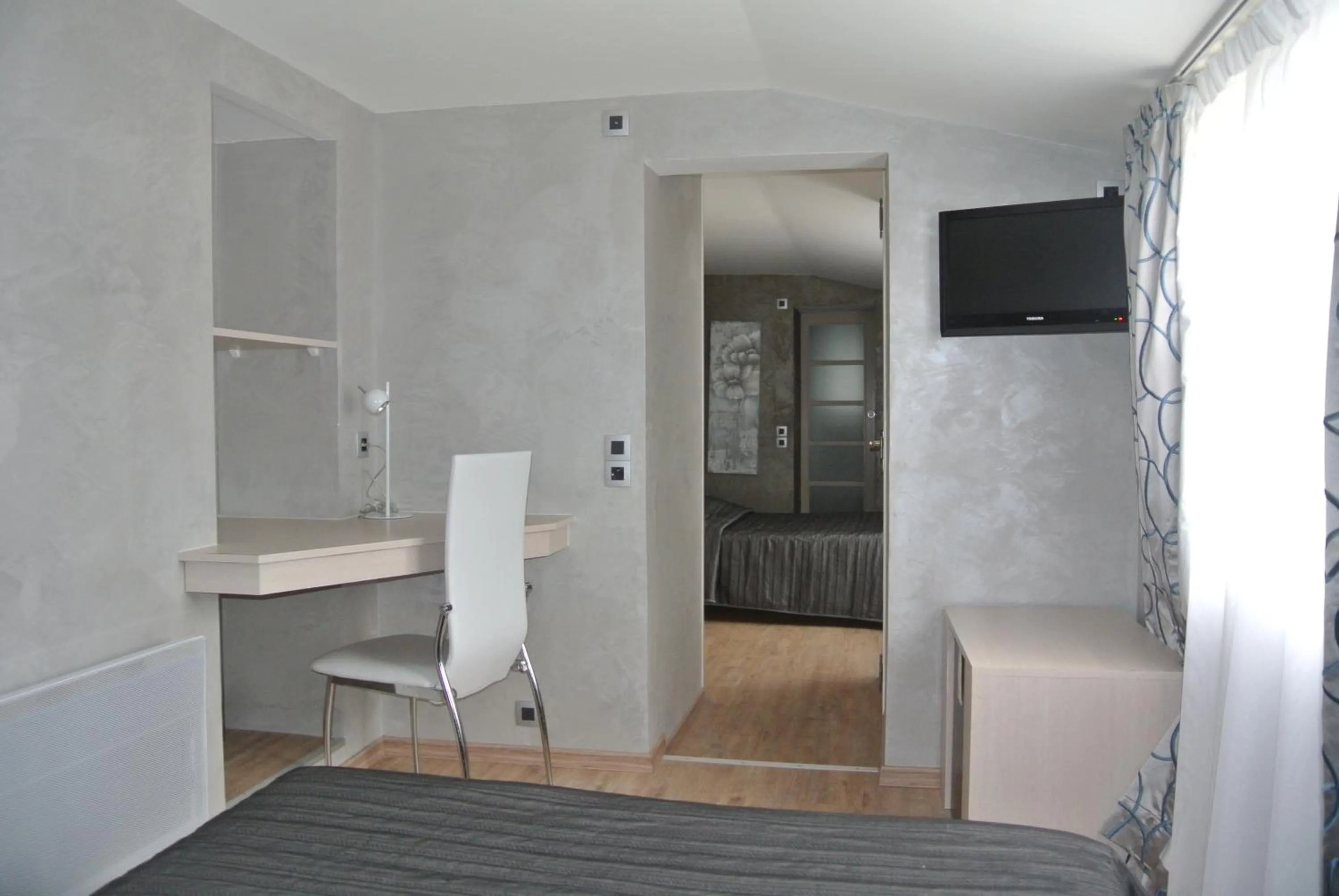 Bedroom in La glycine hotel, spa et bien-être