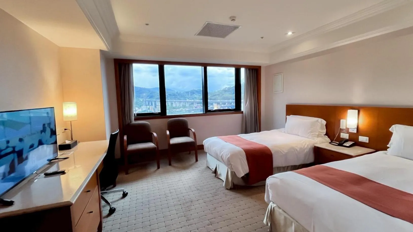 Bed in HiONE Holiday Hotel